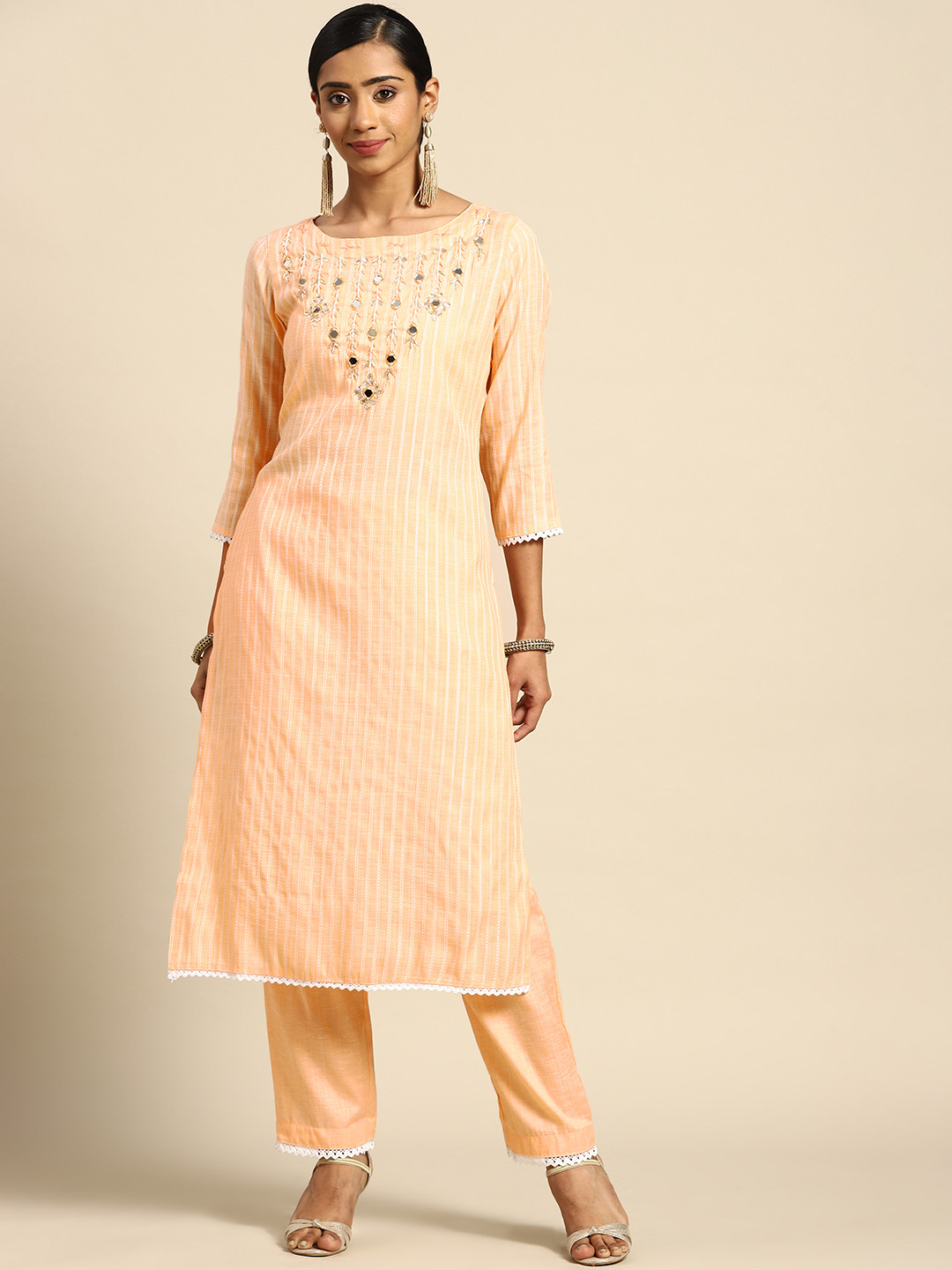 

Prakhya Women Peach-Coloured Yoke Design Mirror Work Kurta with Palazzos
