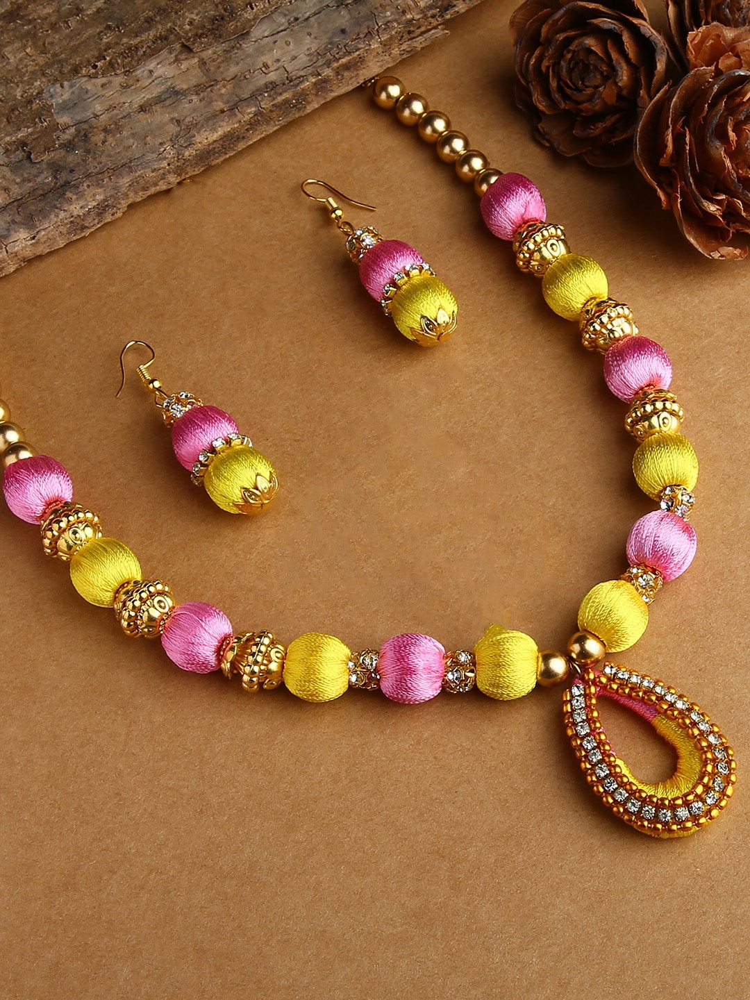 

AKSHARA Girls Gold-Plated & Yellow Stones-Studded & Beaded Jewellery Set