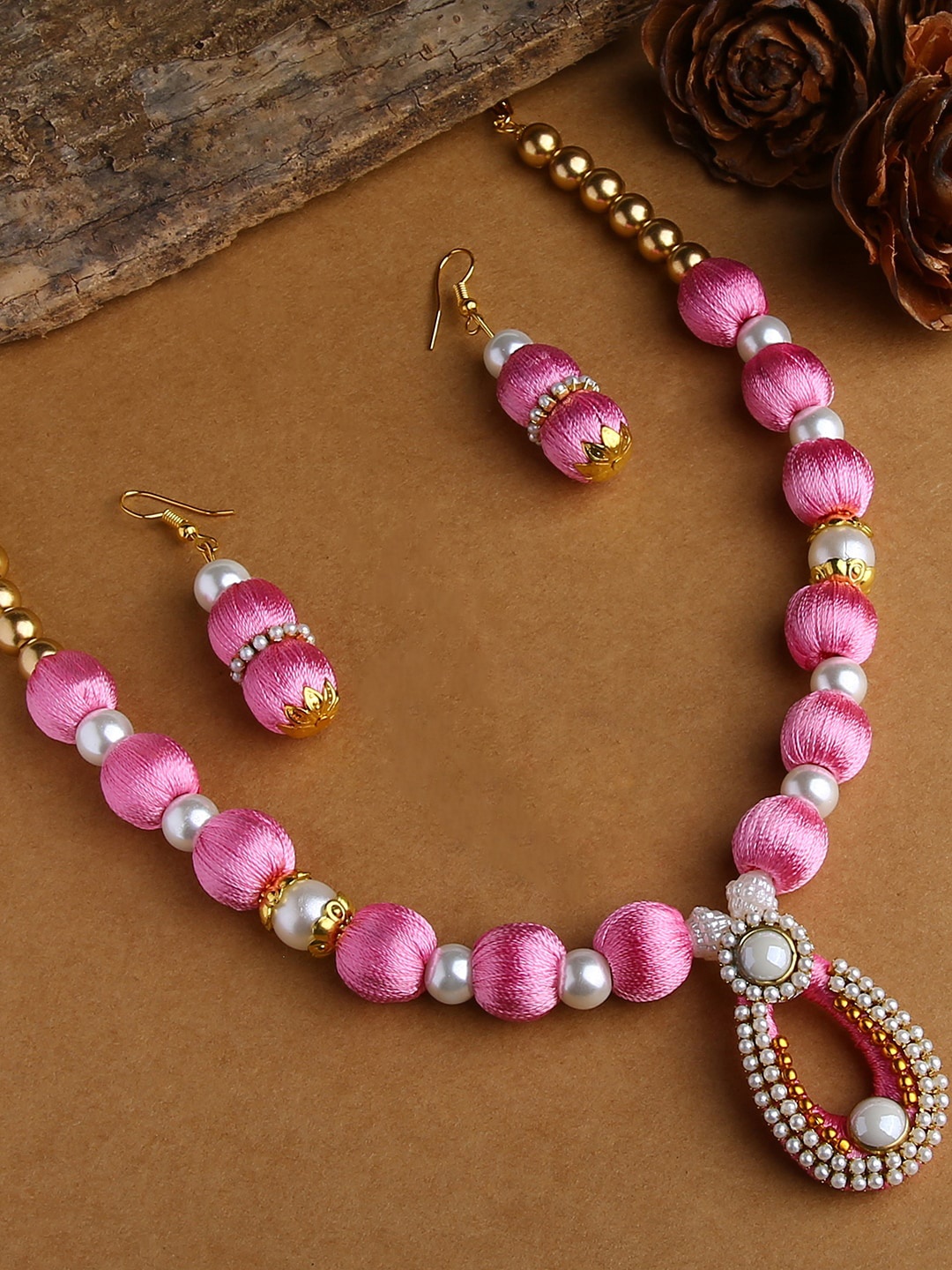 

AKSHARA Gold-Plated White Stone Studded & Beaded & Pink Silk Thread Necklace Set