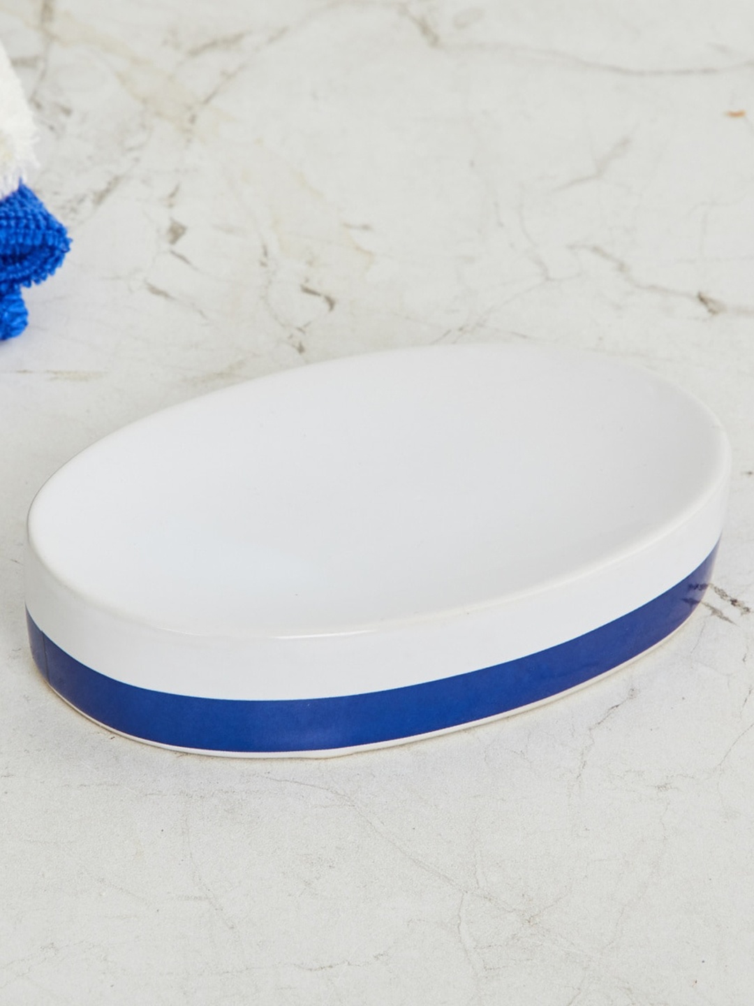 

Home Centre Blue & White Solid Oval Ceramic Soap Dish