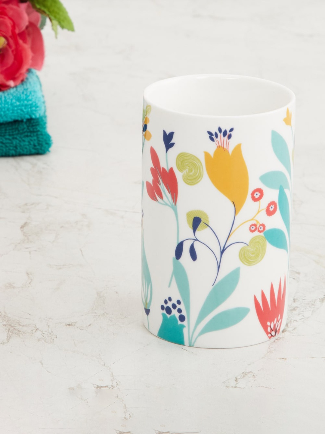 

Home Centre White Printed Ceramic Tooth Brush Holder