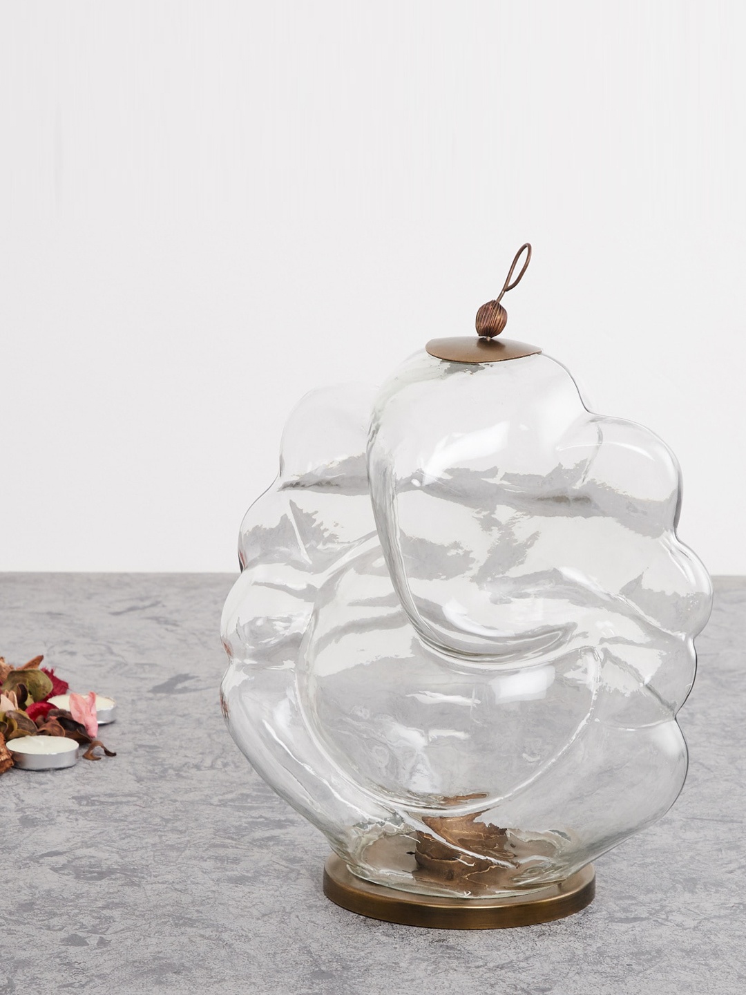

Home Centre Transparent Solid Glass Ganesha Candle Holder