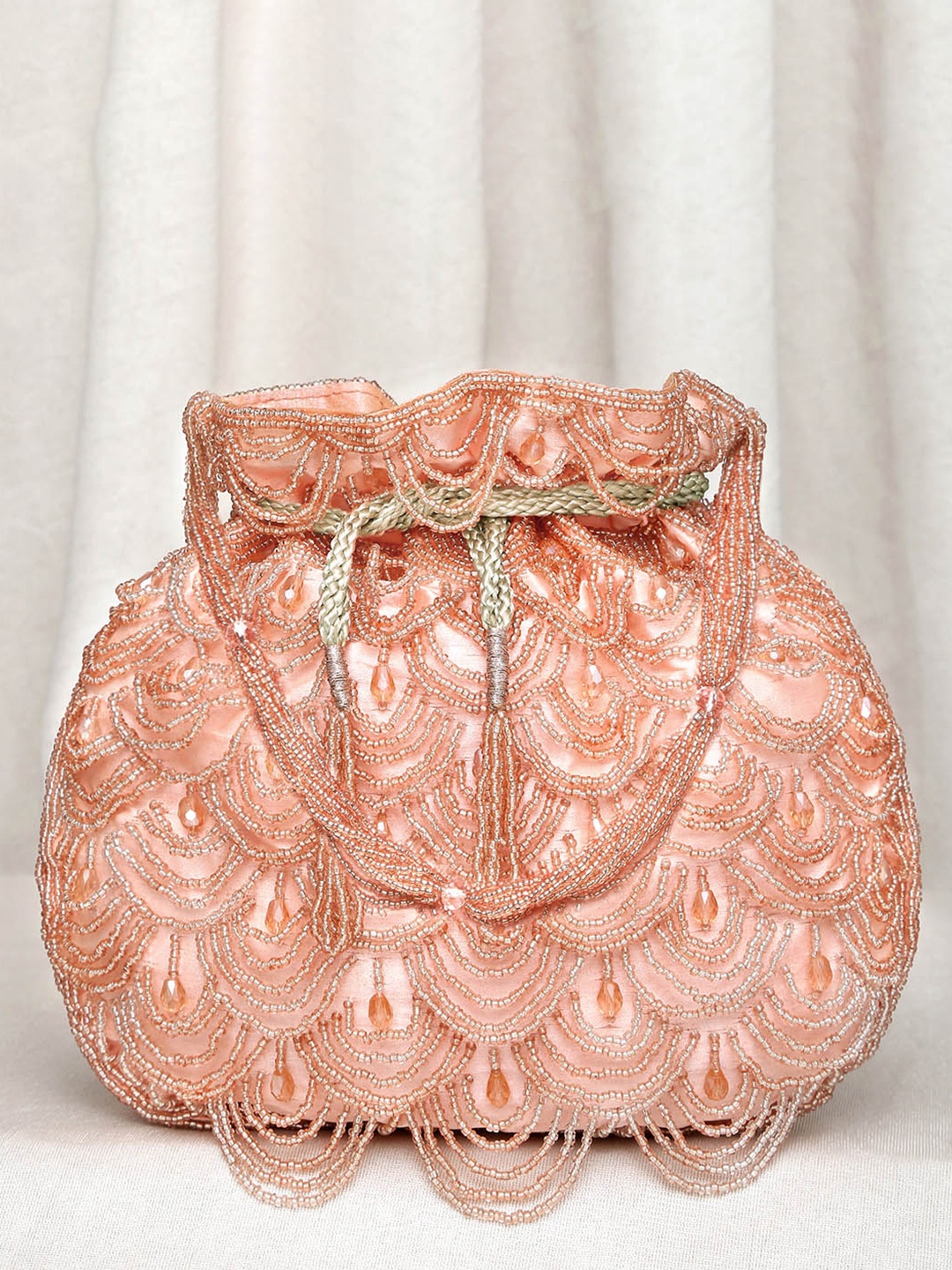 

Peora Peach-Coloured Textured Potli Clutch