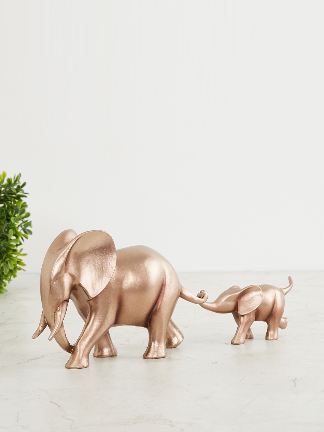 

Home Centre Gold-Toned Walking Mother Baby Figurine Showpiece