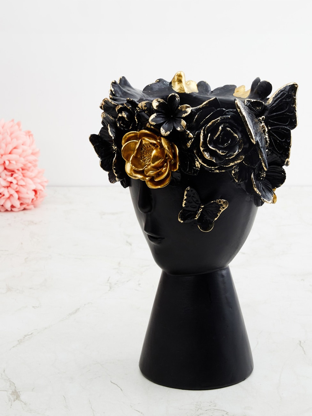 

Home Centre Black & Gold-Toned Ceramic Floral Head Figurine Showpiece