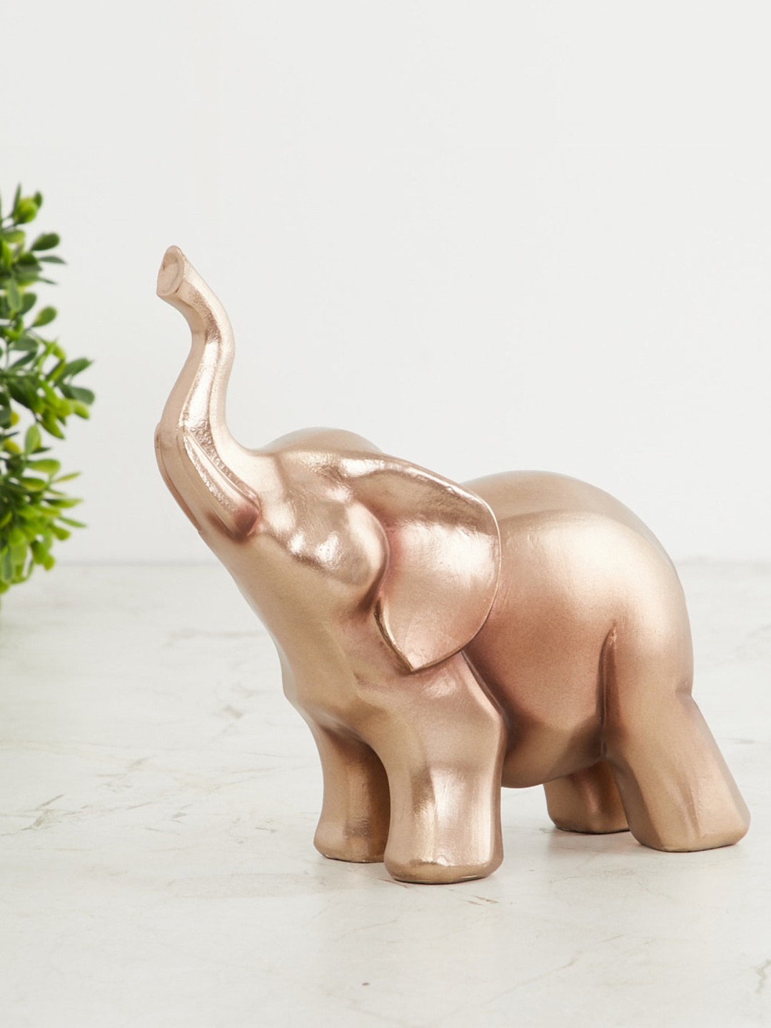 

Home Centre Gold-Toned Trunk Elephant Figurine Showpiece