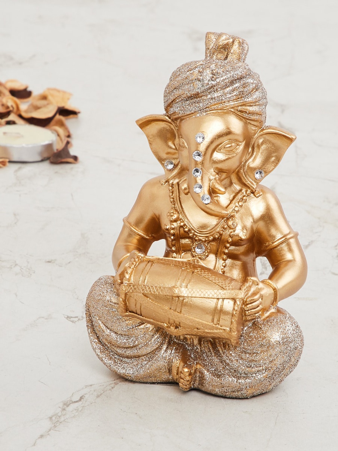 

Home Centre Gold-Toned Embellished Ganesha Musician Figurine Showpiece