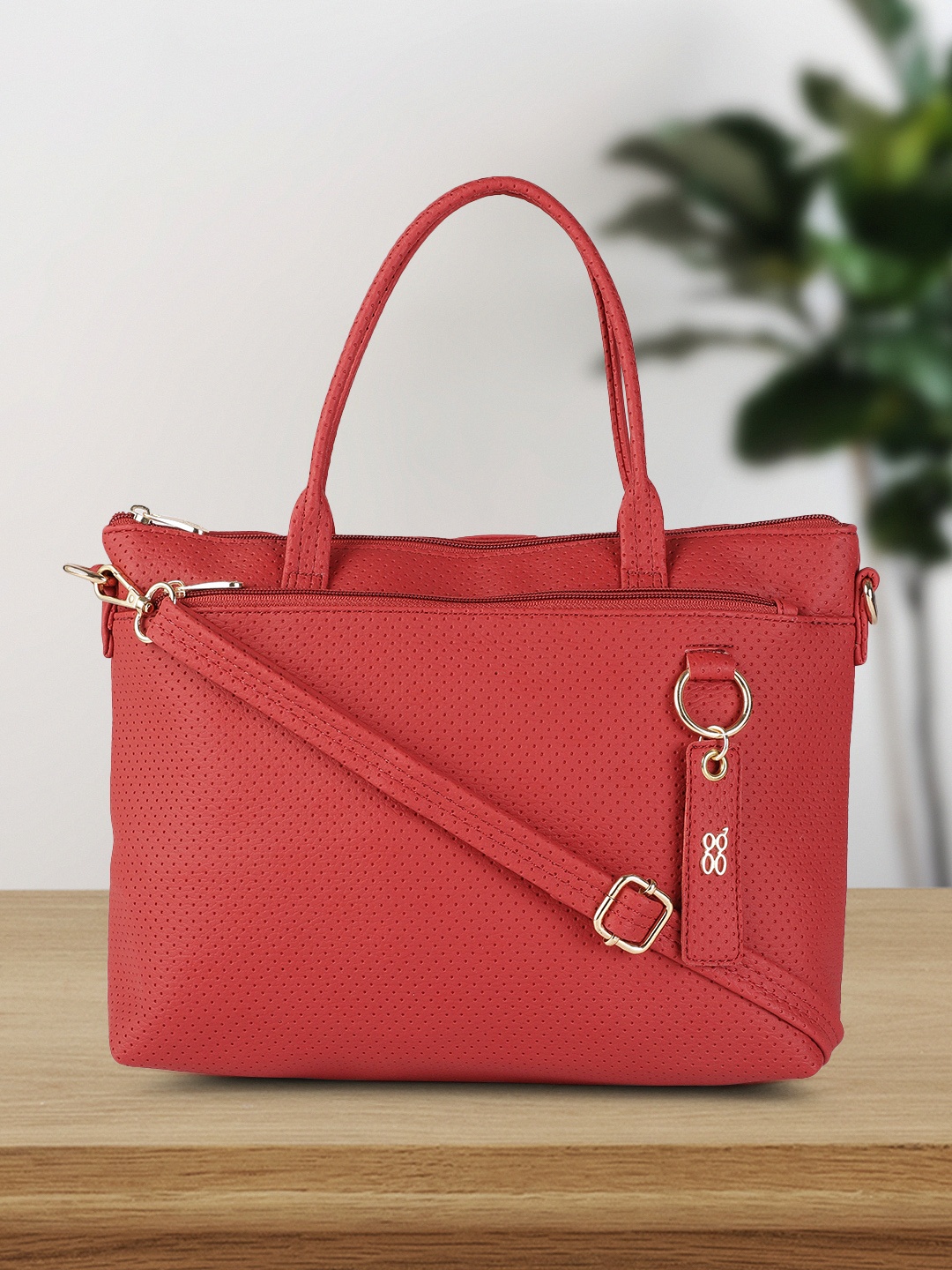 

Baggit Women Red Solid Handheld Bag