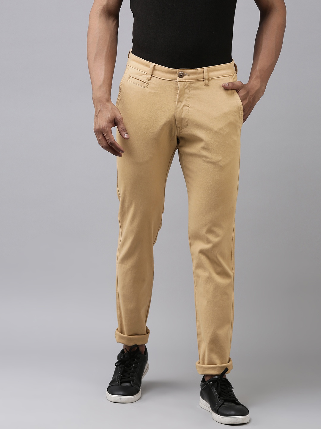 

Van Heusen Sport Men Beige Solid Tapered Fit Regular Trousers