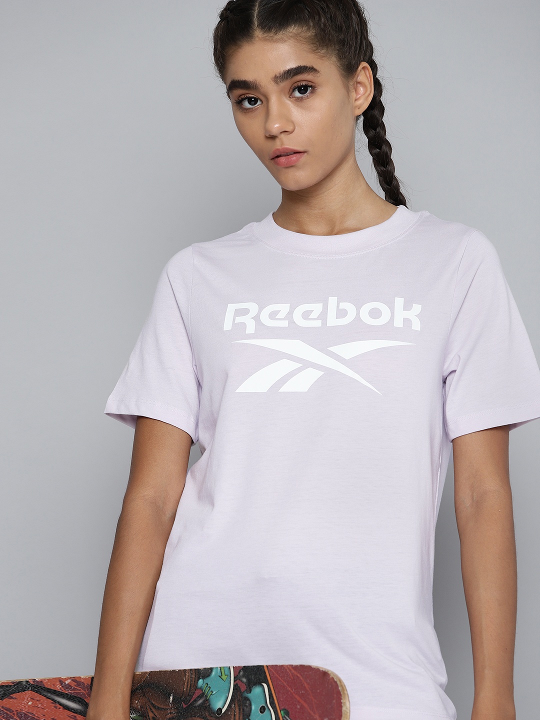 

Reebok Women Lavender Brand Logo Printed Training or Gym T-shirt