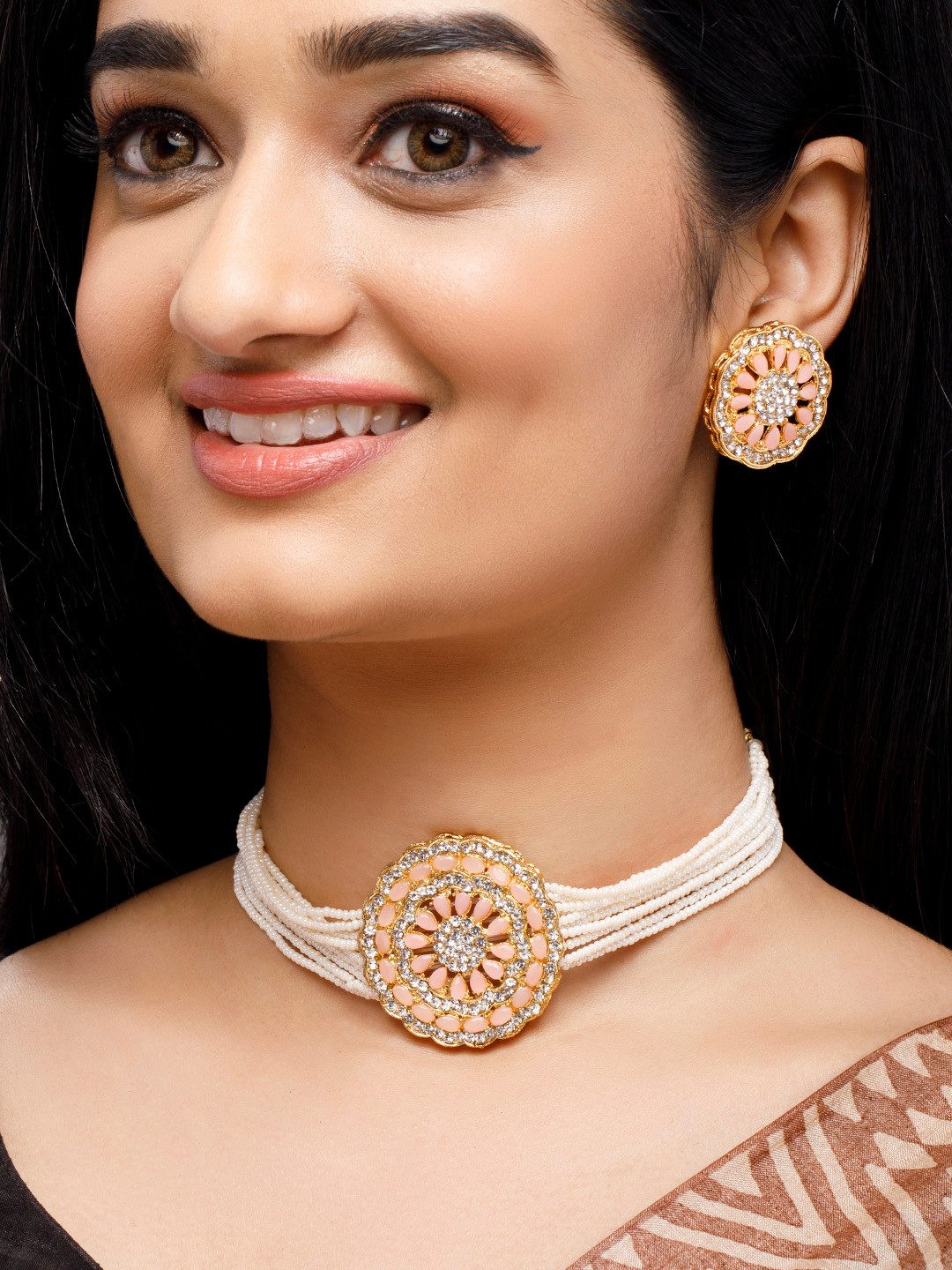 

Anouk Gold-Plated Orange Stone-Studded Cream Beaded Jewellery Set