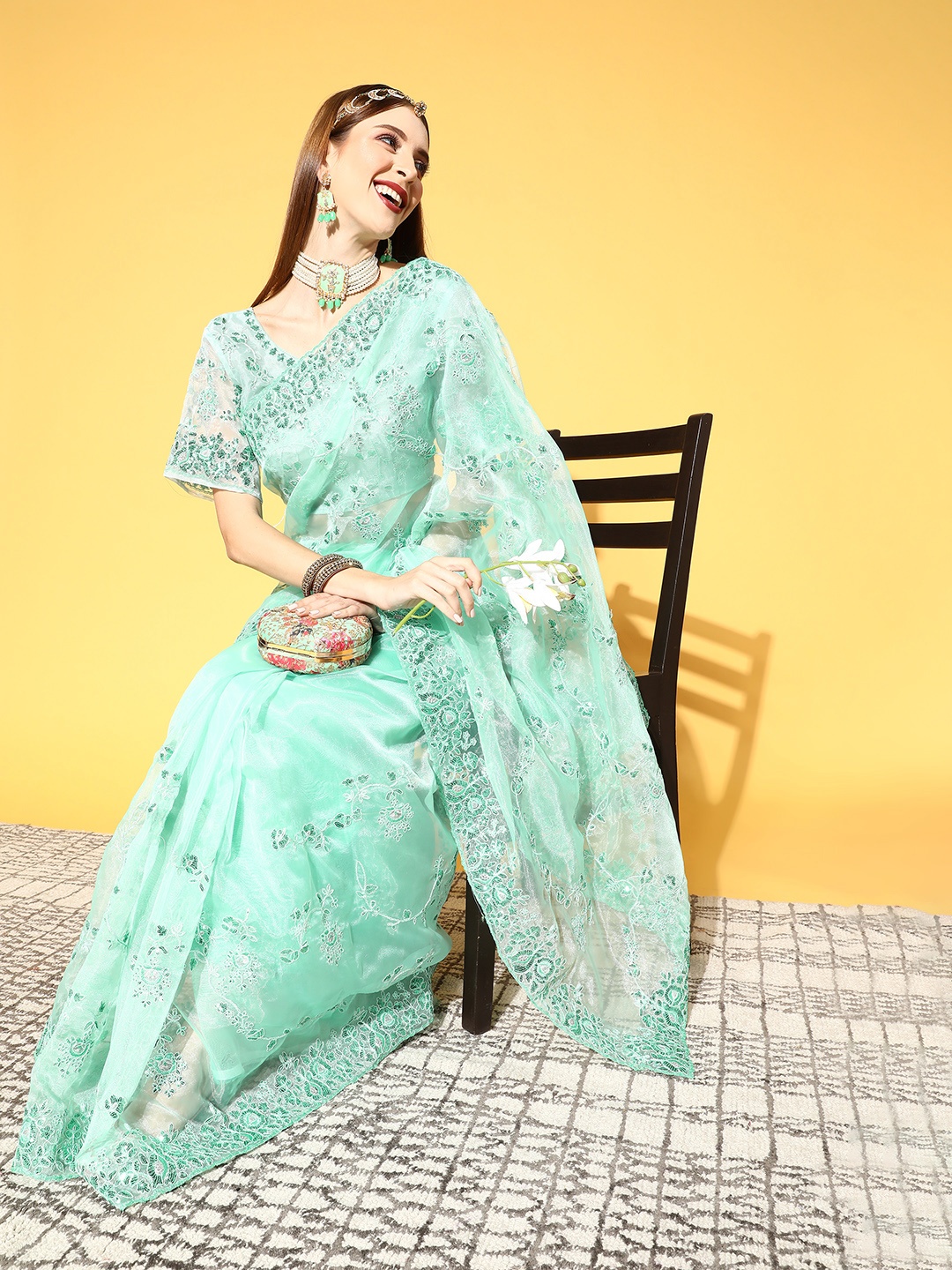 

Mitera Green Ethnic Motifs Aari Work Organza Saree