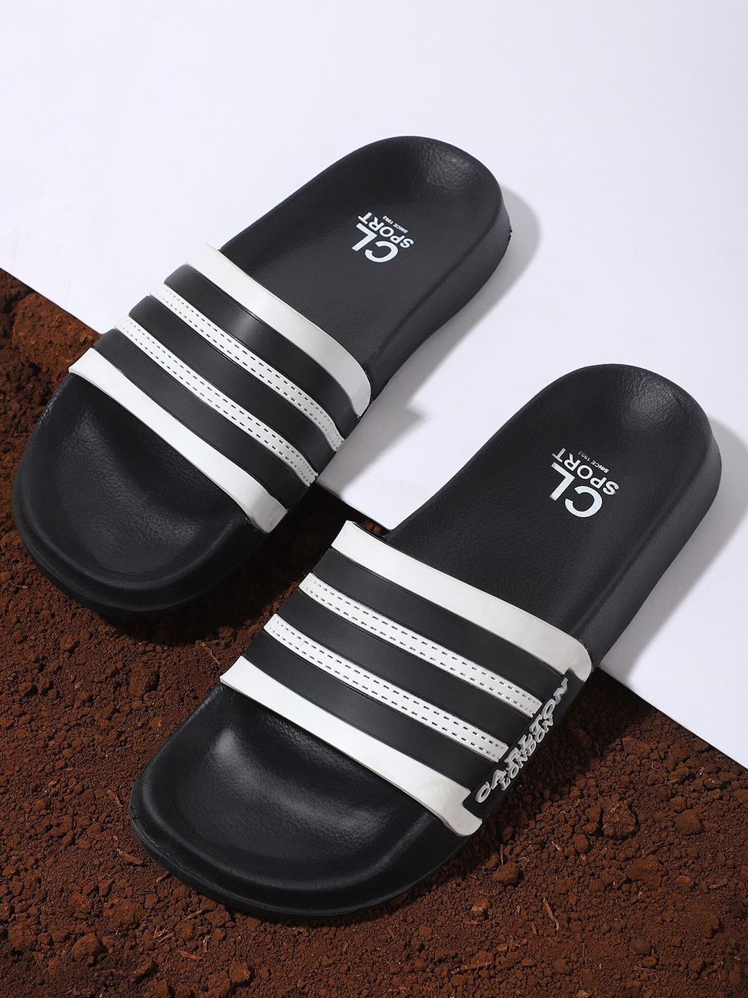 

Carlton London sports Men Black & White Striped Sliders