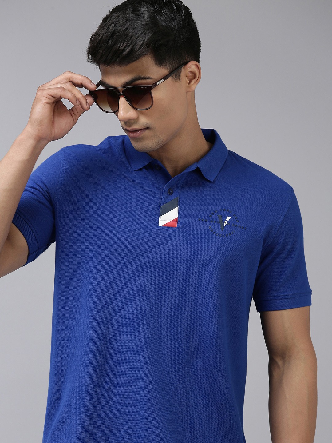 

Van Heusen Sport Men Blue Self Design Pure Cotton Applique Polo T-shirt