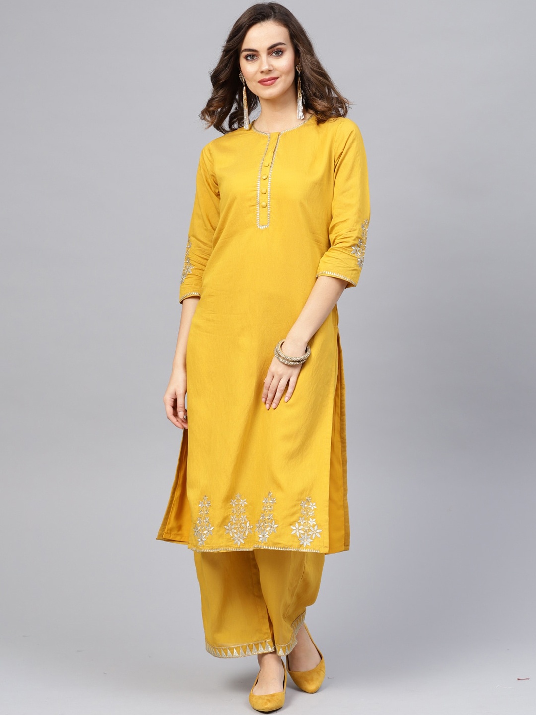 

Indo Era Women Mustard Yellow Pleated Thread Work Kurti with Trousers
