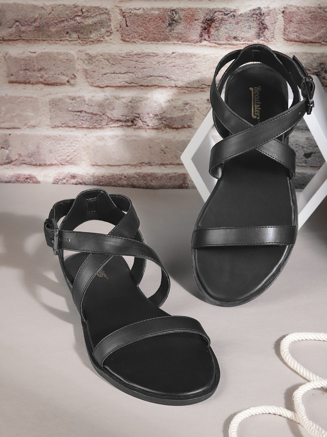 

Roadster Women Black Solid Open Toe Flats with Buckle Closure