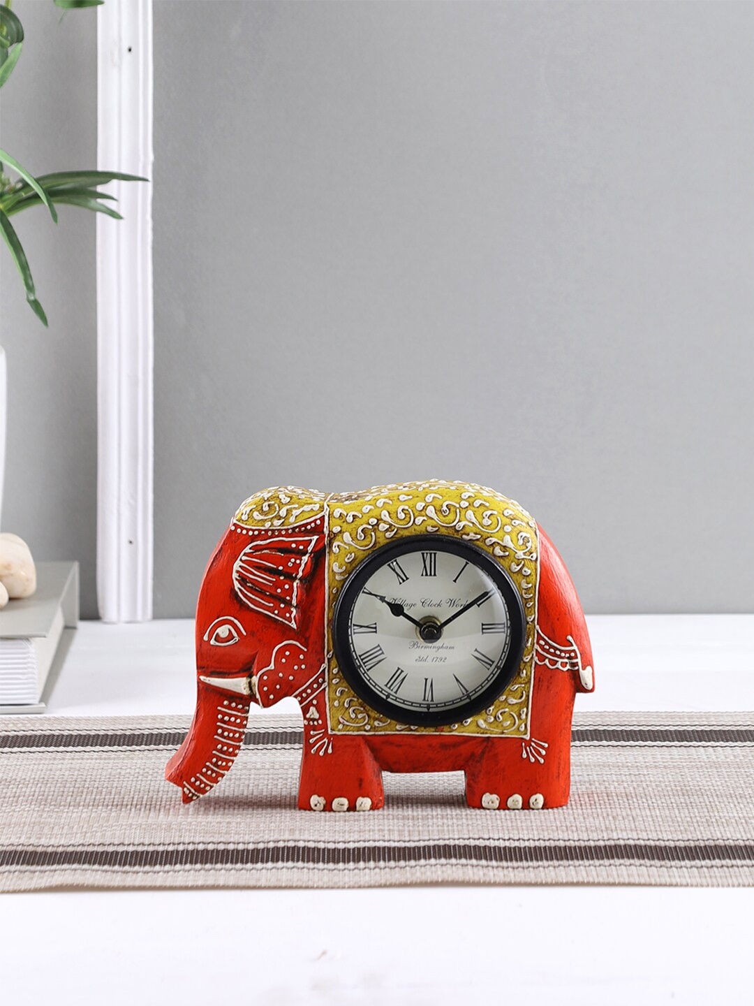 

Aapno Rajasthan Orange & Yellow Animal Shaped Traditional Table Clock
