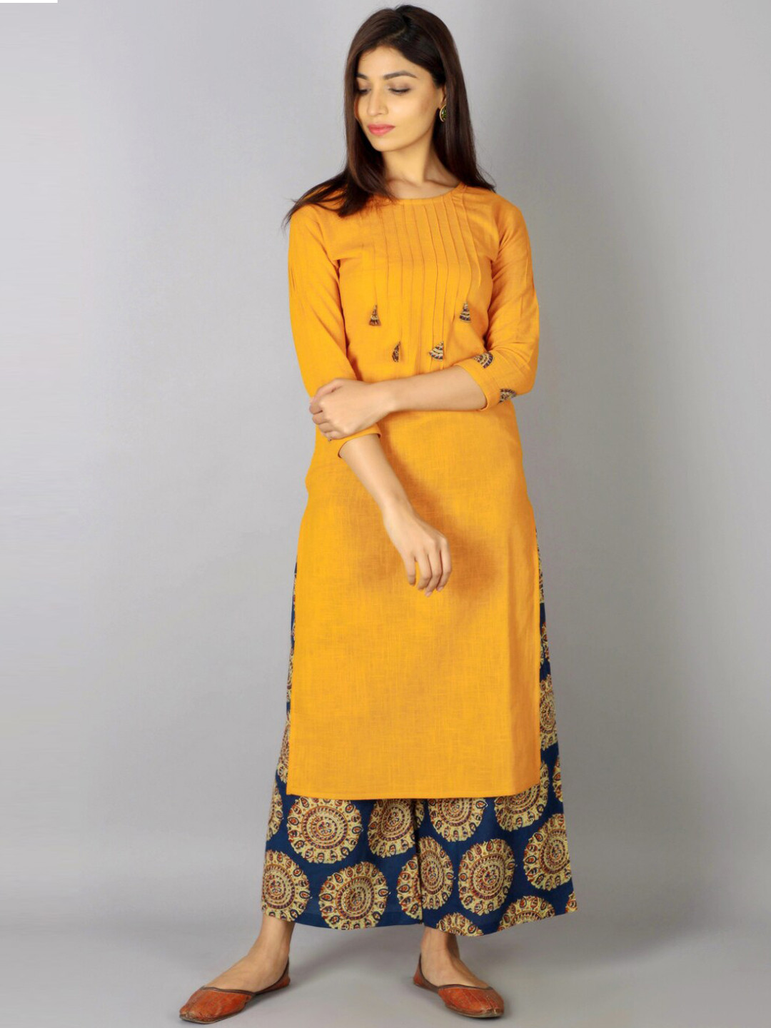 

KALINI Women Yellow Ethnic Motifs Embroidered Kurta with Palazzos