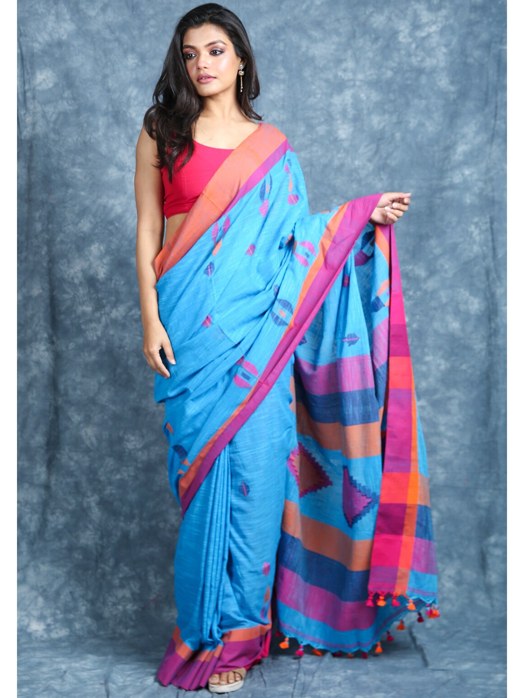 

Arhi Blue & Orange Ethnic Motifs Saree