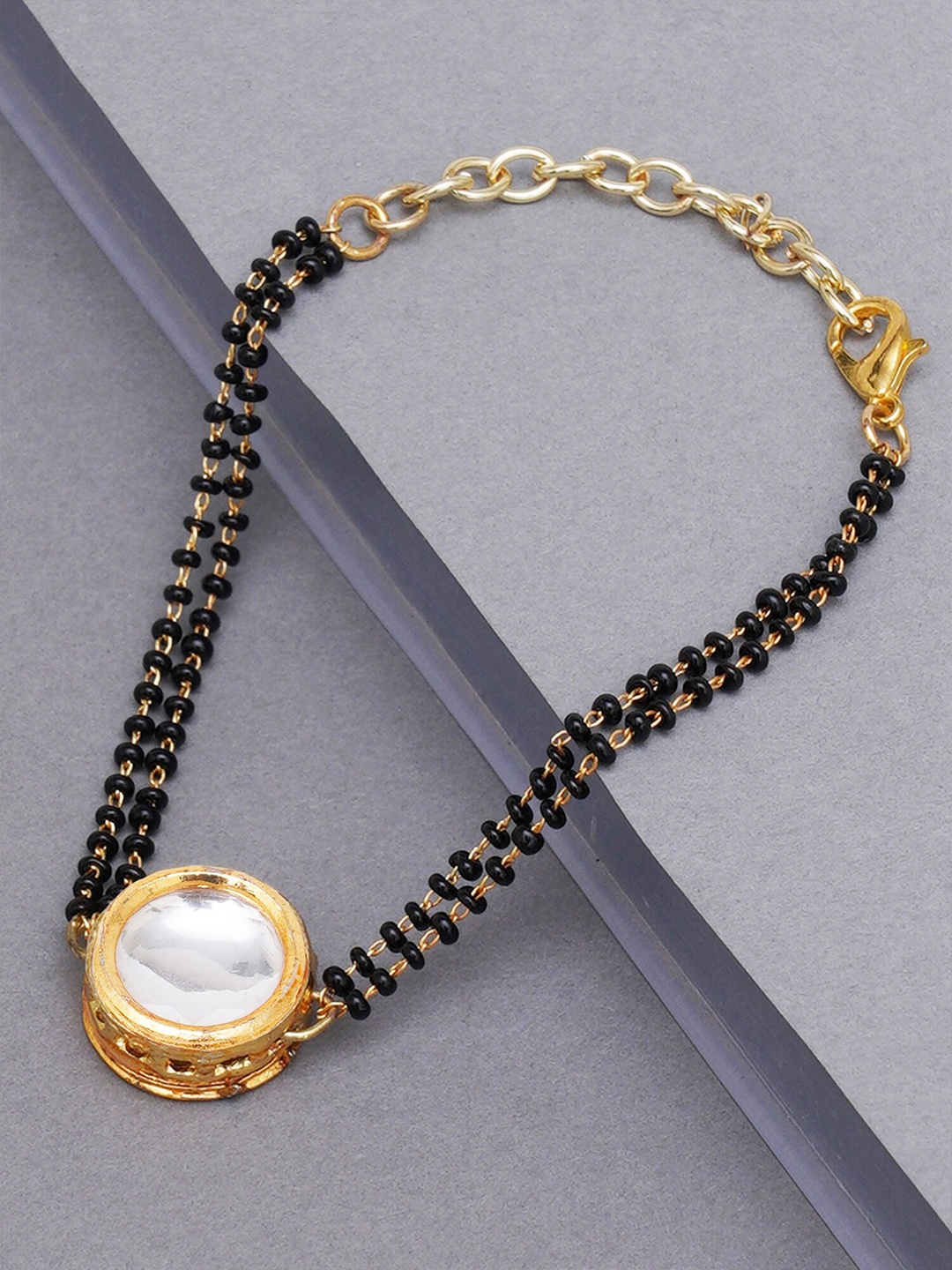 

KARATCART Women Gold & Black Kundan Handcrafted Charm Bracelet