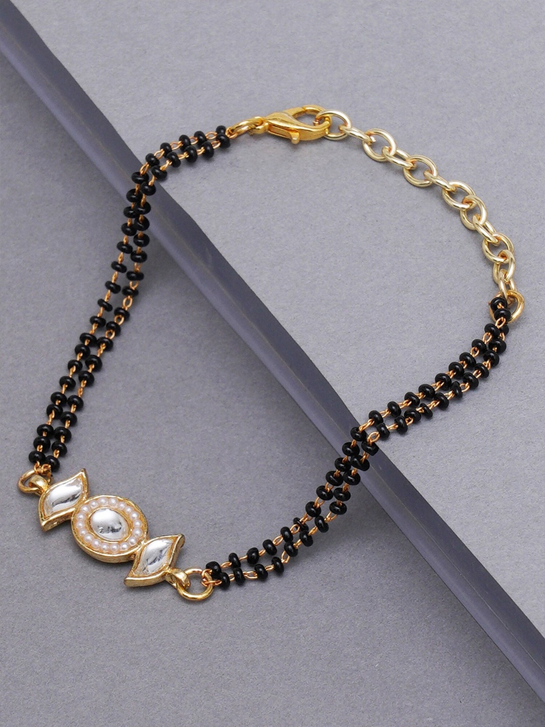 

KARATCART Women Gold & Black Kundan Handcrafted Charm Bracelet