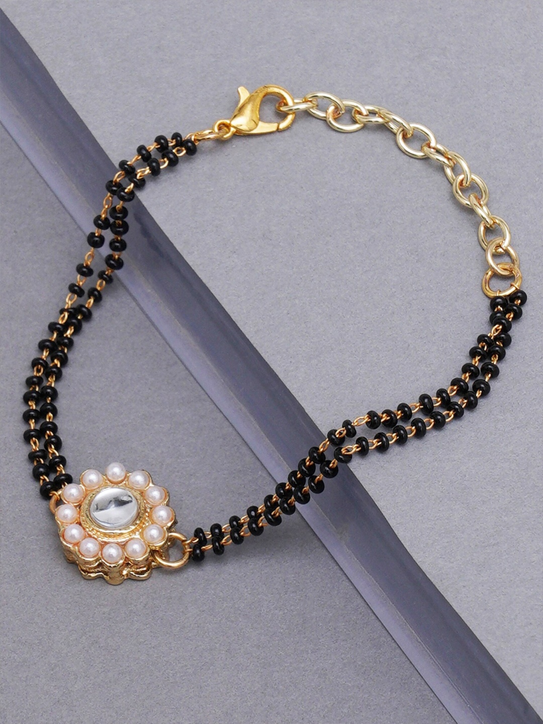 

KARATCART Women Gold-Plated & Black Charm Bracelet