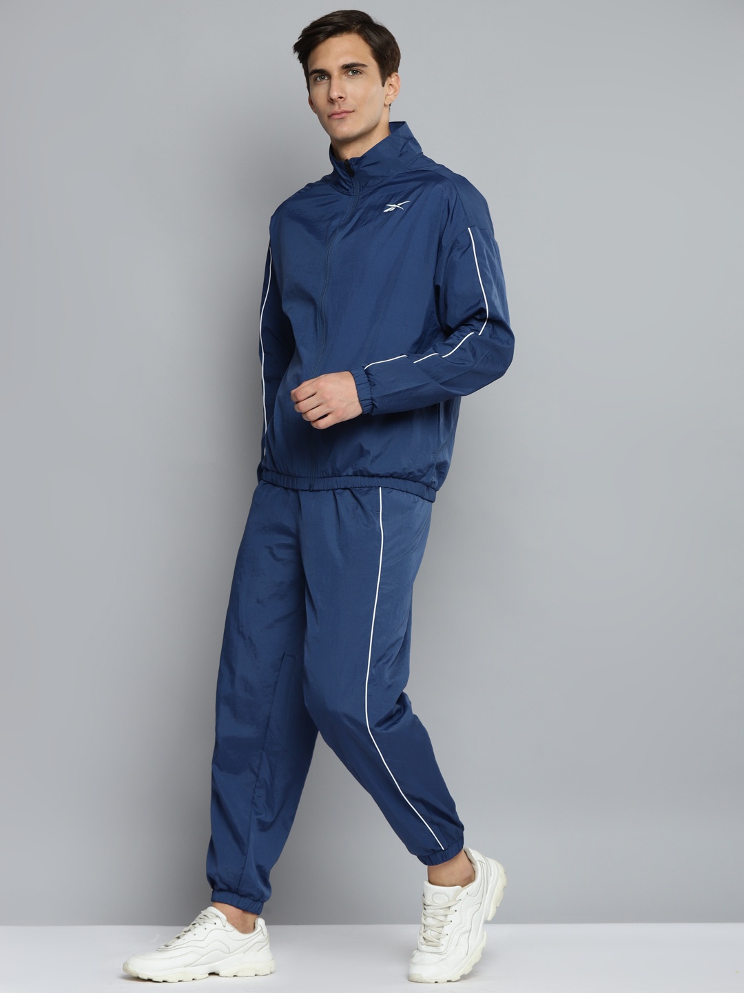 

Reebok Men Blue Solid Training Workout Ready Tracksuit