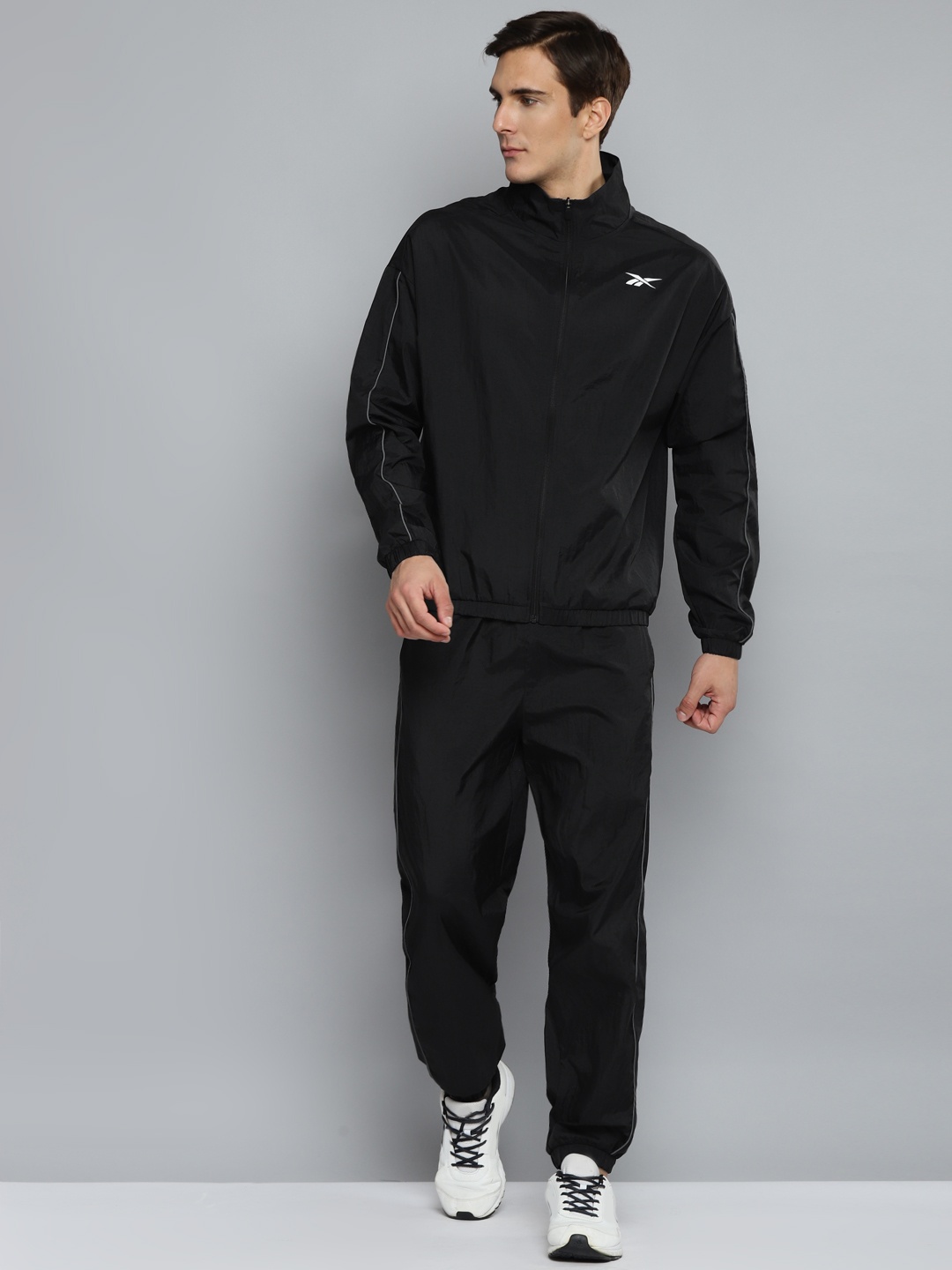 

Reebok Men Black Solid Training Workout Ready Tracksuit