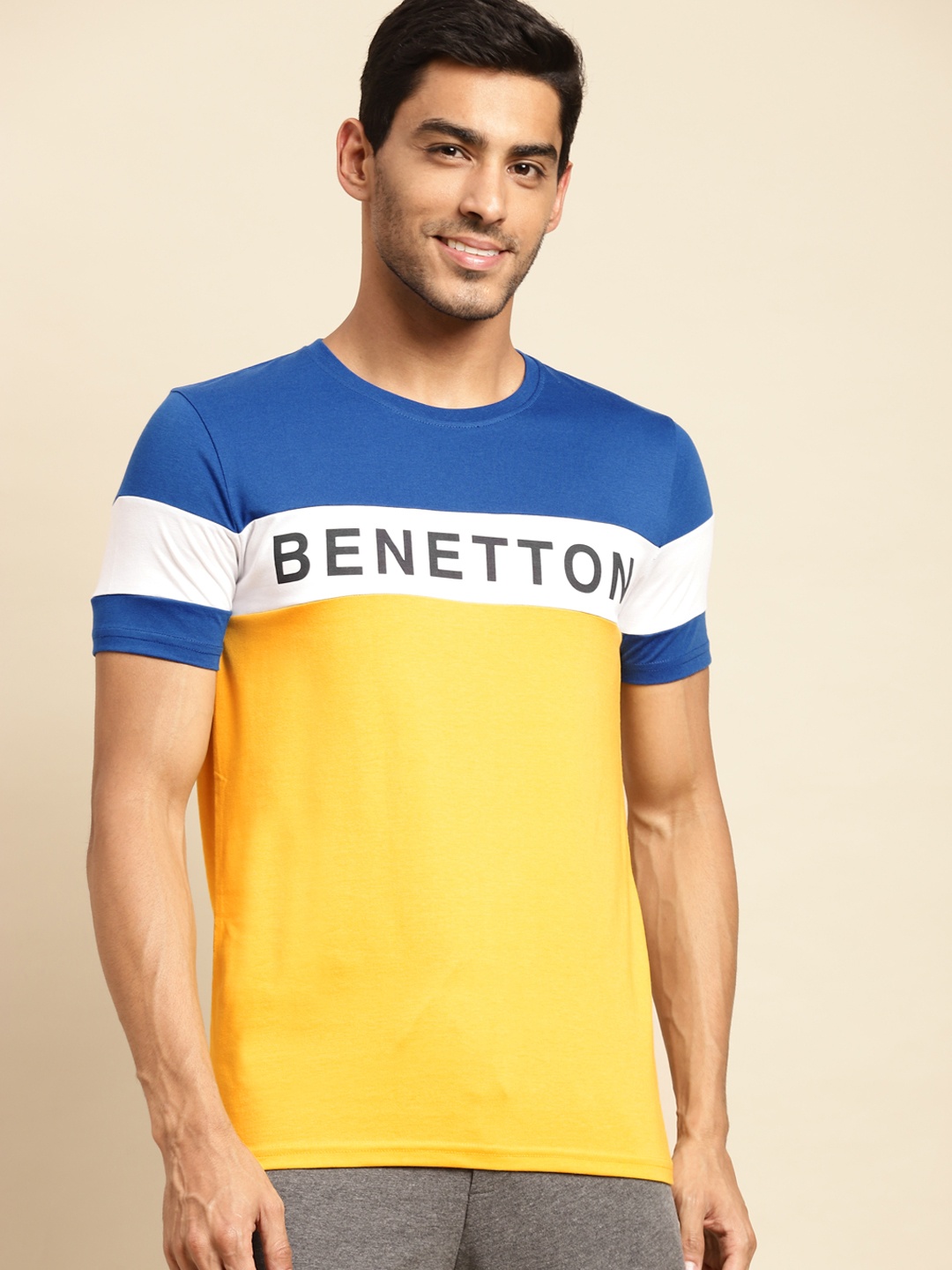 

United Colors of Benetton Men Blue & Yellow Brand Logo Colourblocked T-shirt
