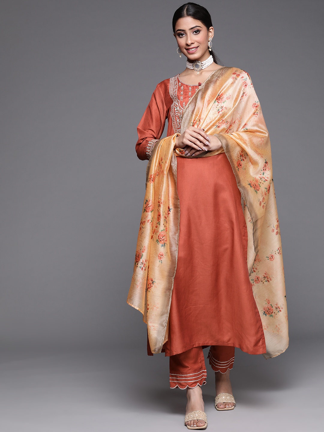 

Varanga Women Rust Red Ethnic Motifs Embroidered Yoke Design Kurta with Trousers & Dupatta