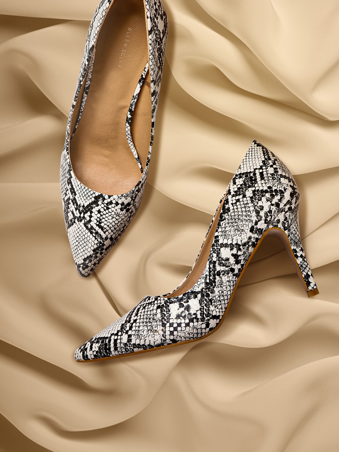 

Allen Solly Women White & Charcoal Grey Snakeskin Textured Pumps
