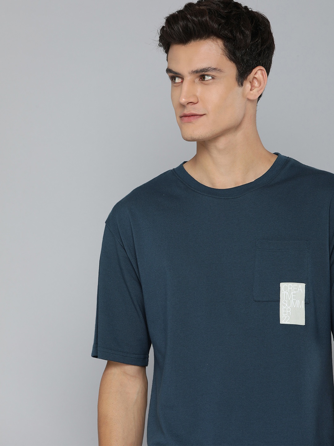 

Mast & Harbour Men Navy Blue Solid Appliqued T-shirt