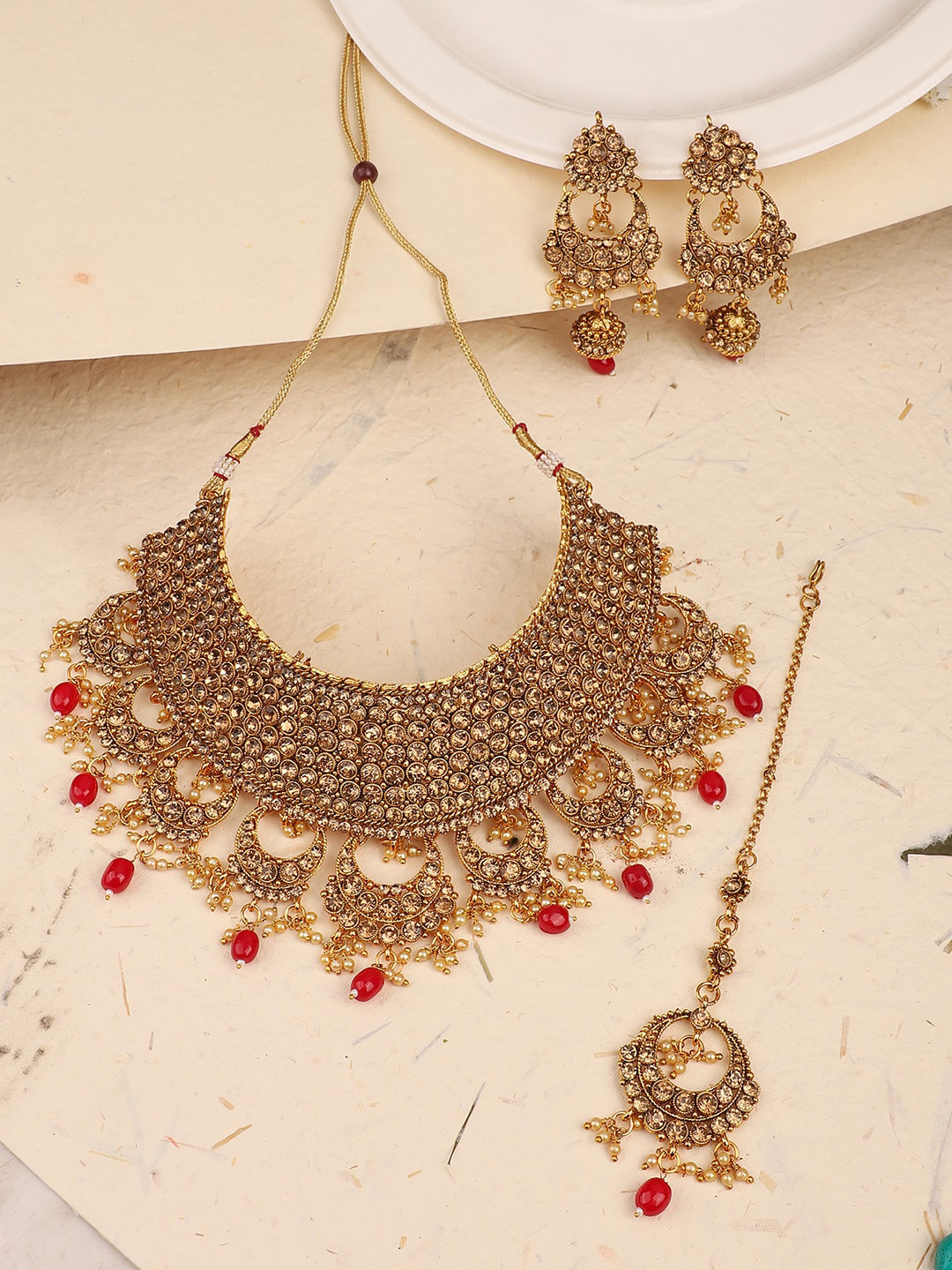 

ANIKAS CREATION Gold-Plated Red Hasli Style Choker Cutwork Stone-Studded Jewellery Set