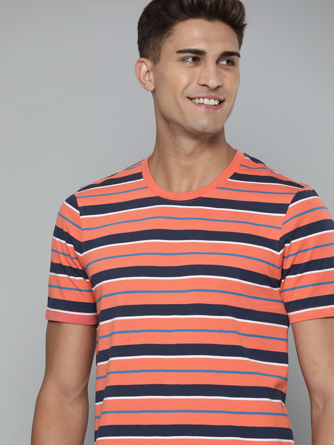 

Mast & Harbour Men Coral Red & Navy Blue Striped T-shirt