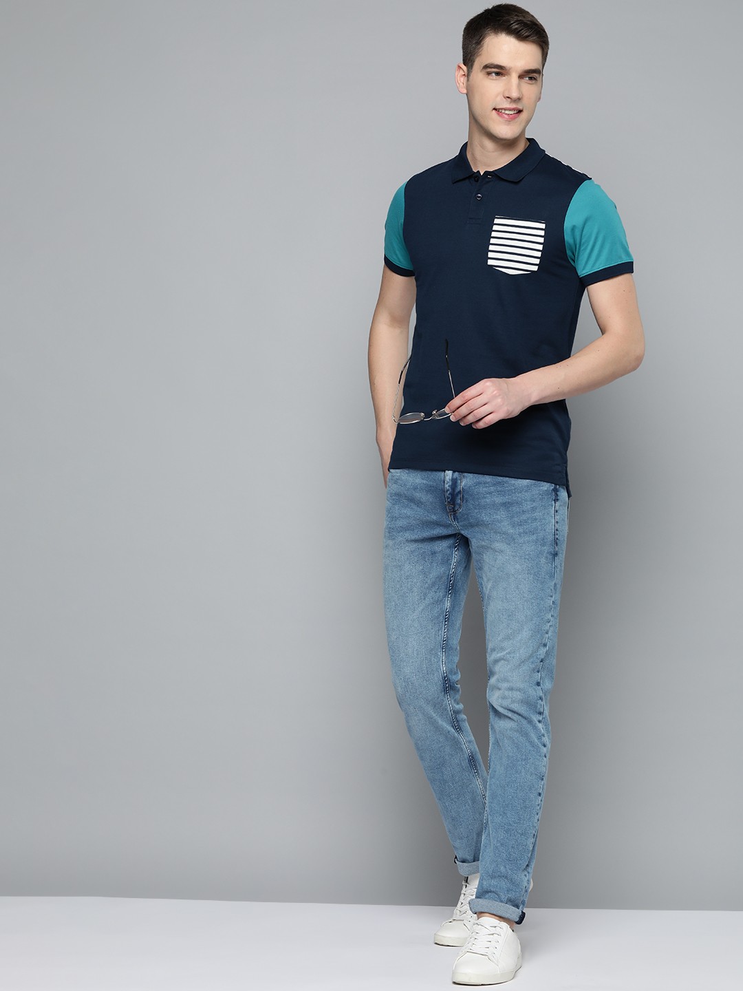 

Mast & Harbour Men Navy Blue Solid Polo Collar Casual T-shirt With Contrast Pocket