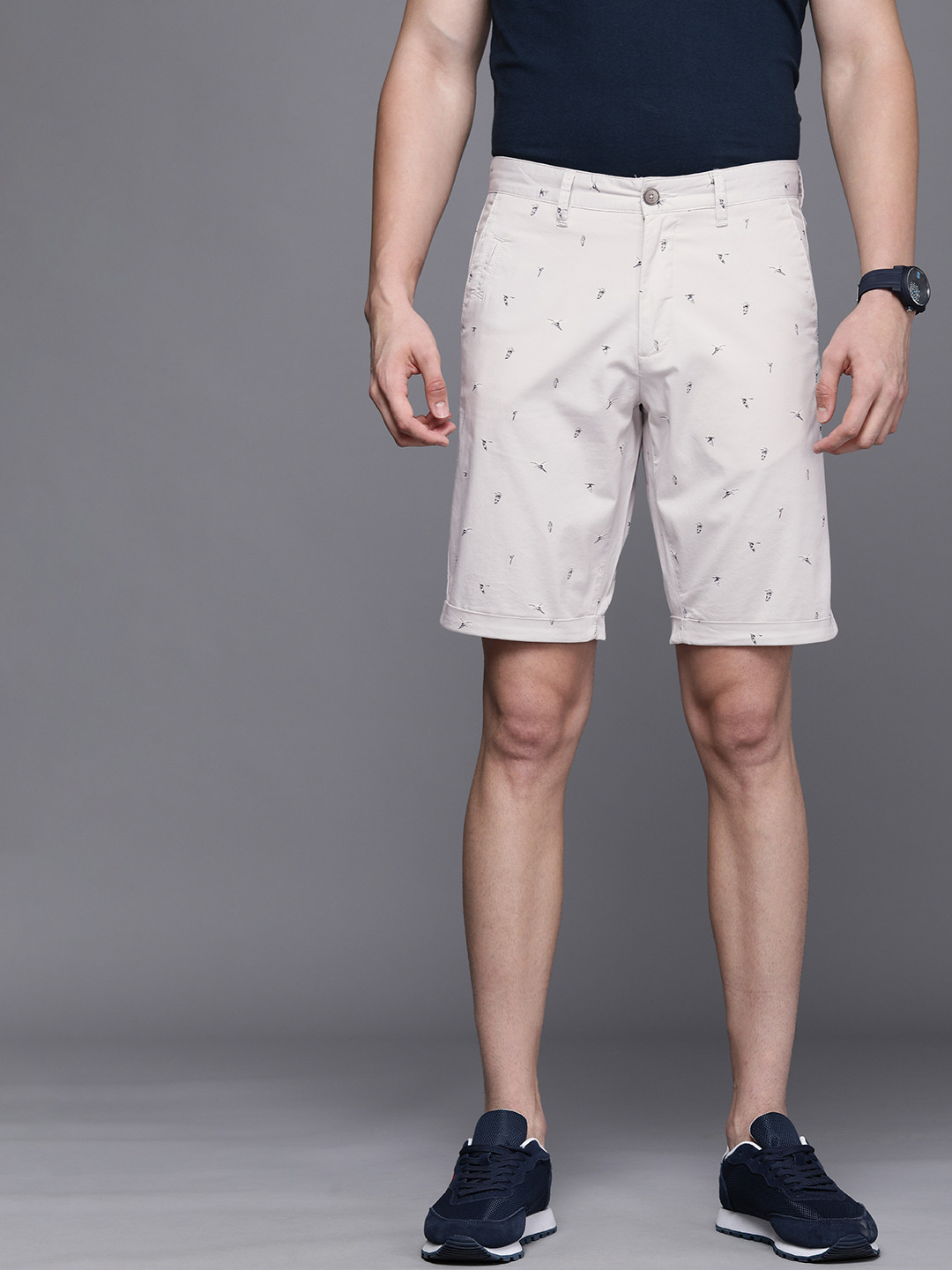 

Louis Philippe Sport Men Beige & Black Conversational Printed Slim Fit Shorts