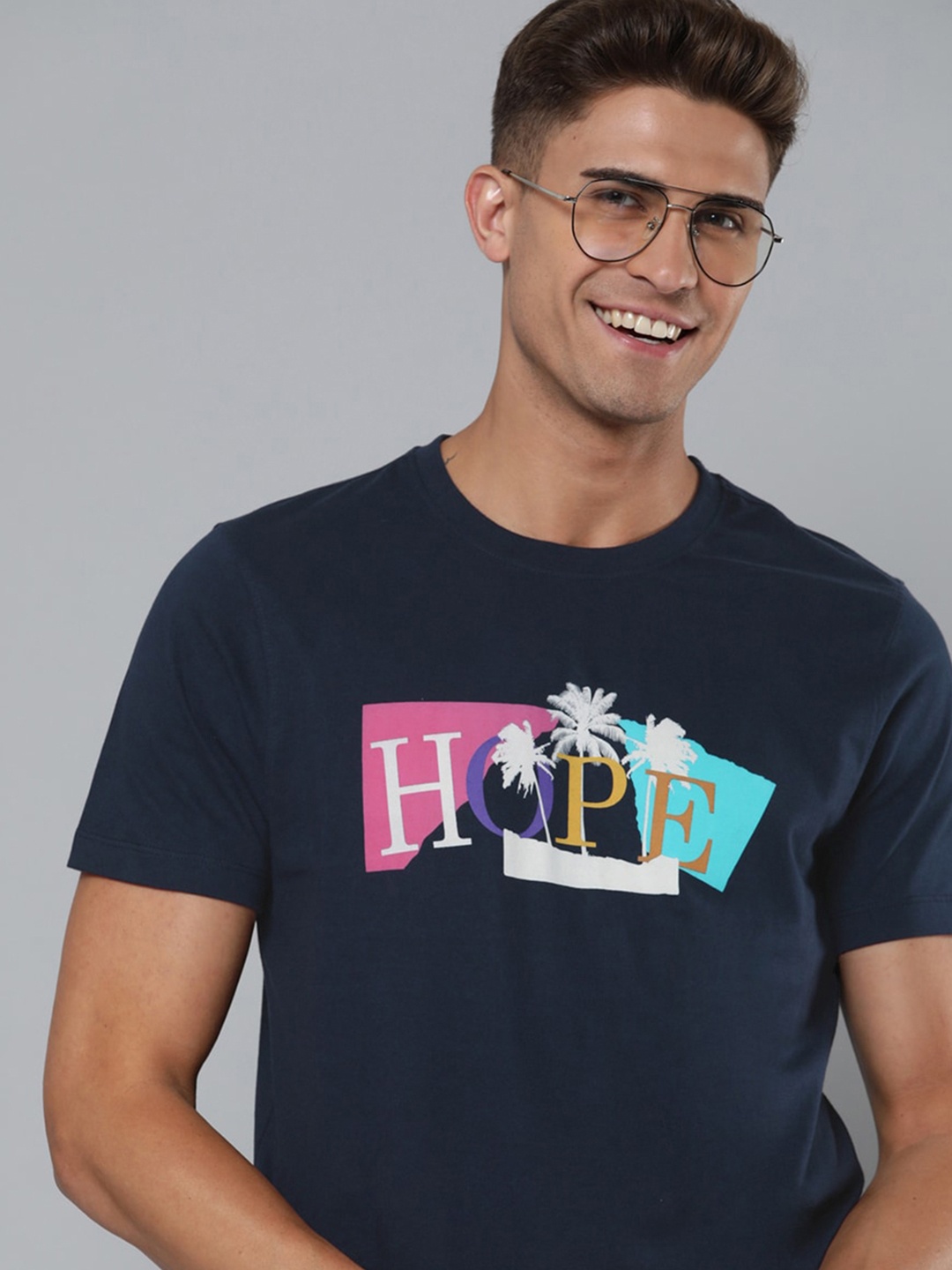 

Mast & Harbour Men Navy Blue & White Pure Cotton Typography Printed Tropical T-shirt