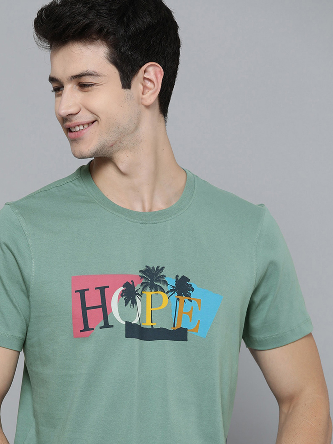 

Mast & Harbour Men Green & Navy Blue Pure Cotton Typography Printed Tropical T-shirt