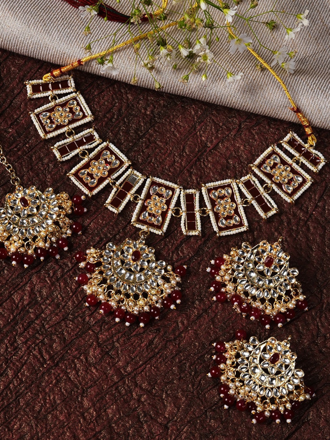 

SOHI Gold-Plated White & Maroon Stone-Studded & Pearl Beaded Jewellery Set