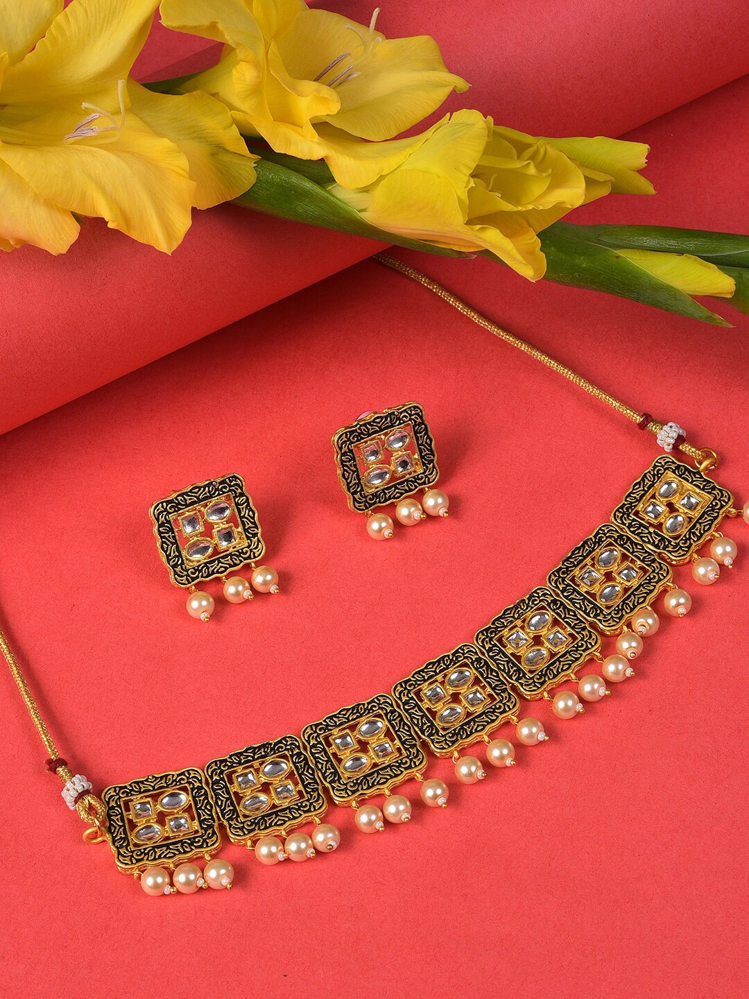 

SOHI Gold-Plated White & Black Stone-Studded & Pearl Beaded Jewellery Set