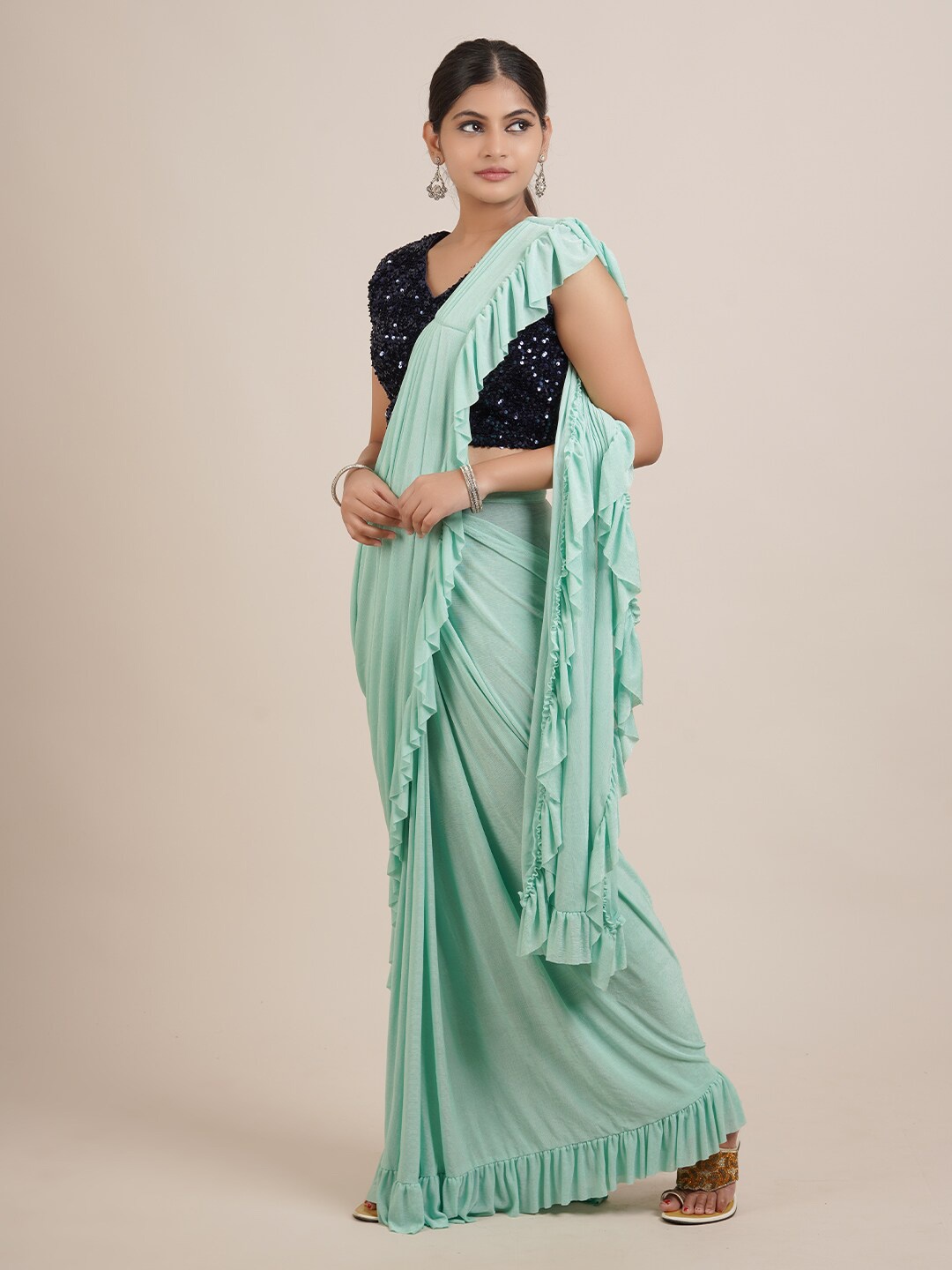 

Pothys Green & Black Sequinned Satin Ruffle Saree