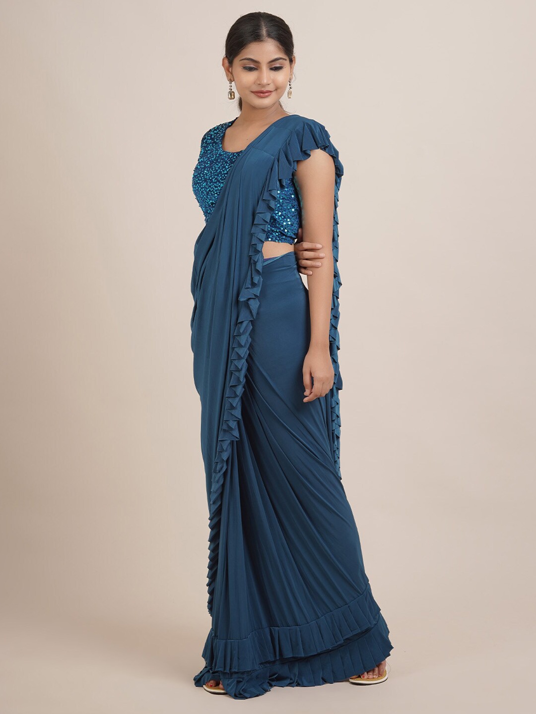 

Pothys Blue Sequinned Solid Satin Saree