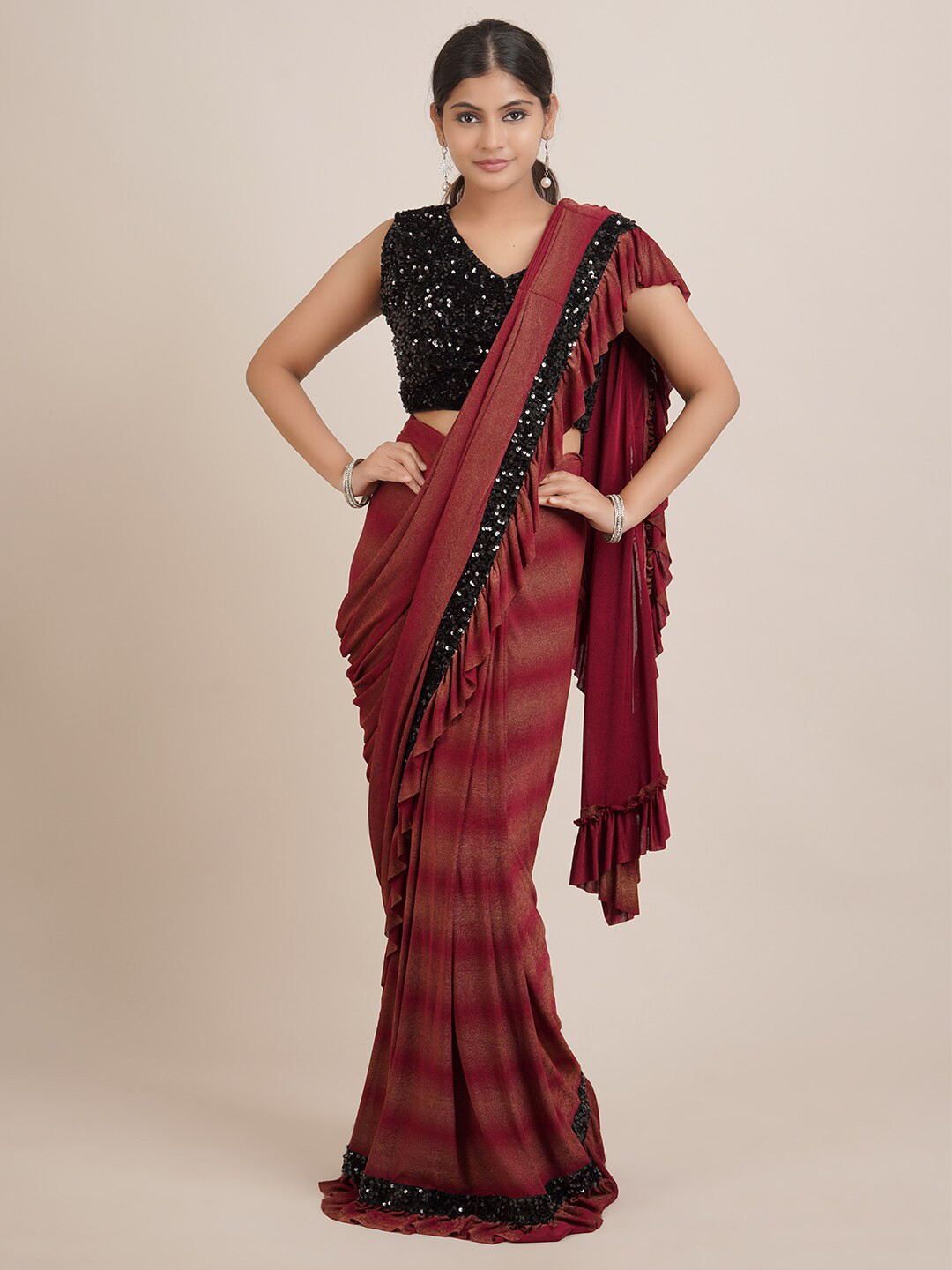 

Pothys Maroon Striped Sequinned Saree