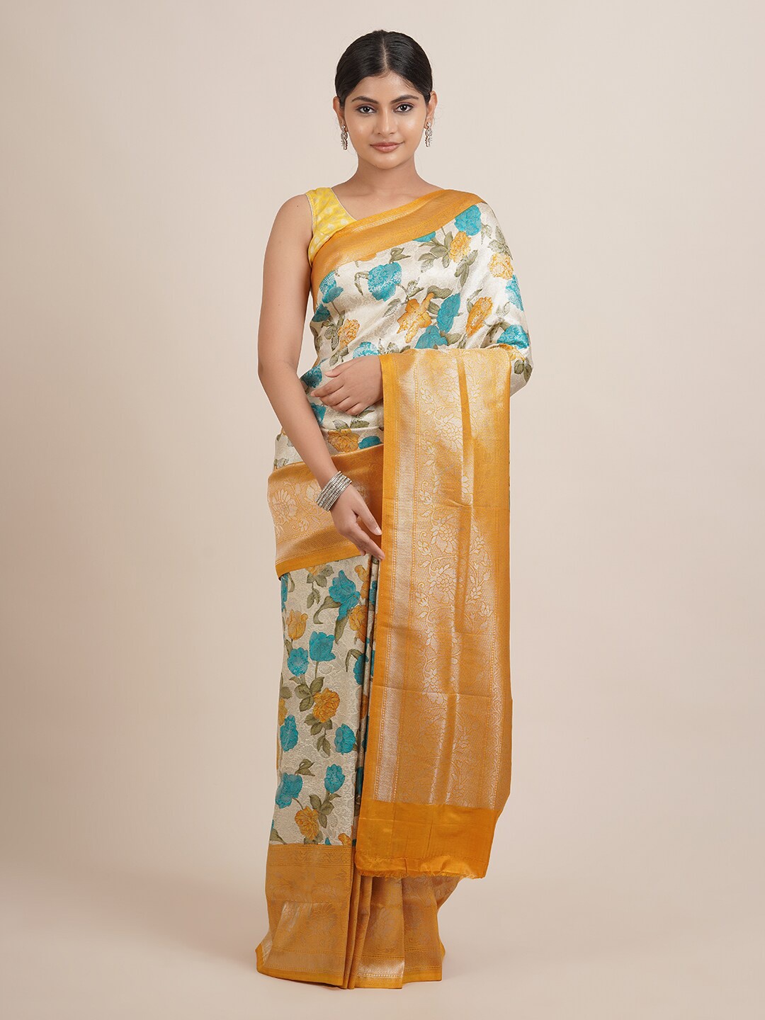 

Pothys Cream-Coloured & Orange Floral Zari Jute Silk Saree