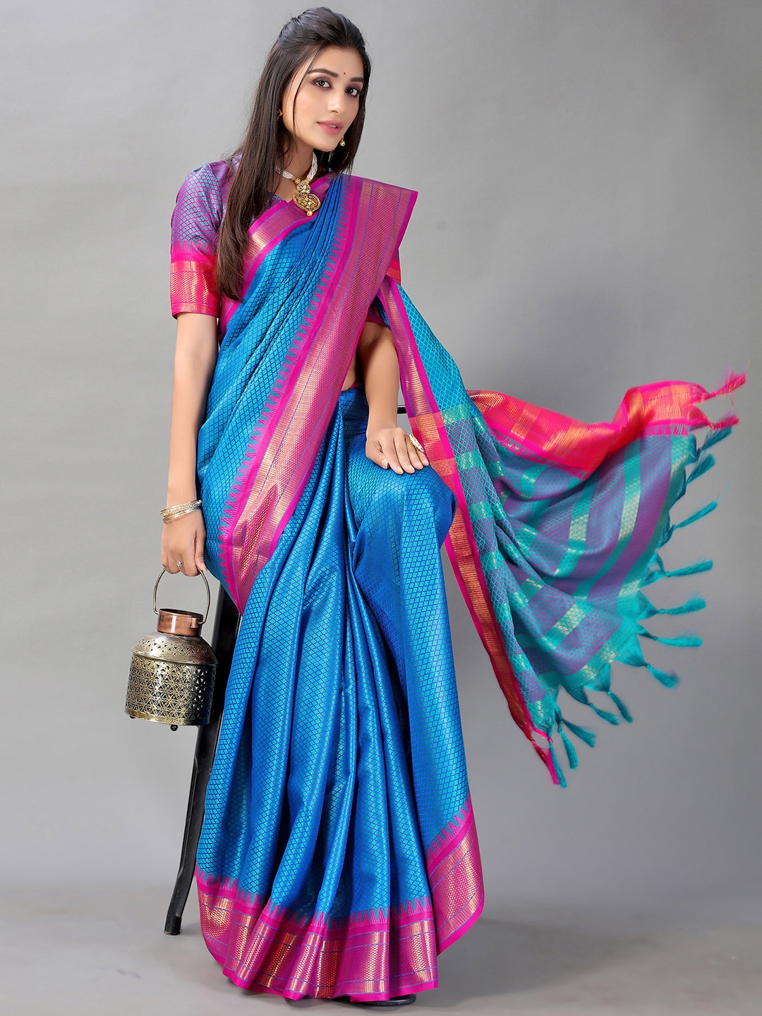 

Satrani Teal & Pink Ethnic Motifs Zari Saree