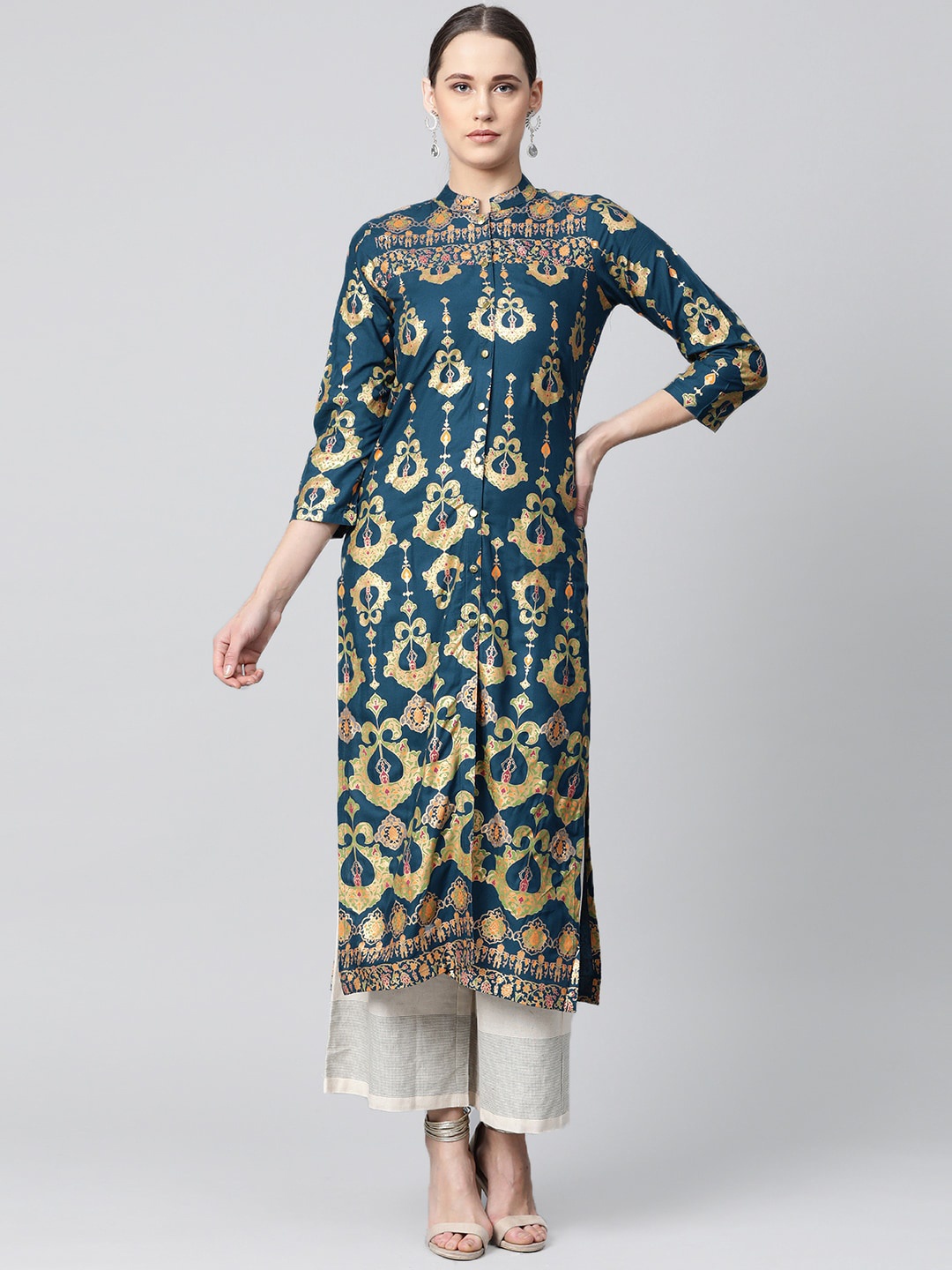 

Jompers Women Teal Blue & Golden Ethnic Motifs Printed Kurta