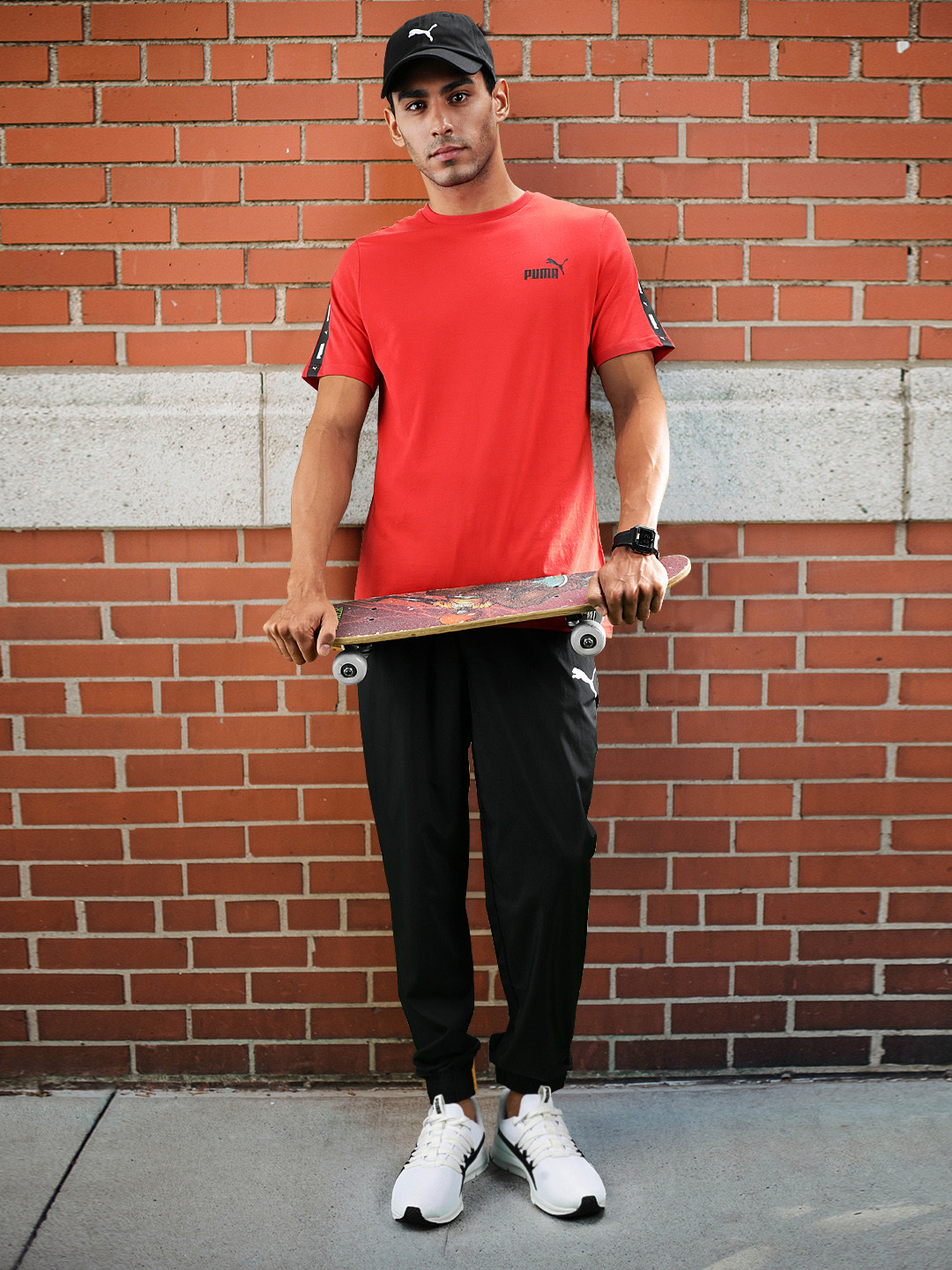 

Puma Men Black Brand Logo Printed Woven Regular Joggers