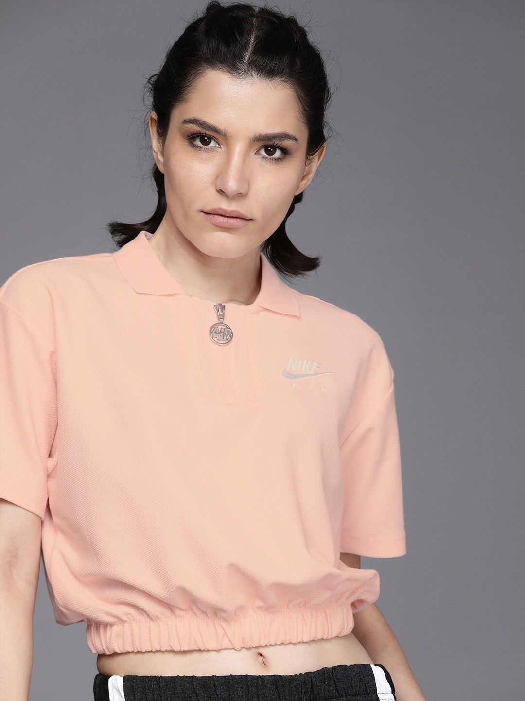 

Nike Women Peach-Coloured Self-Design Polo Collar T-shirt