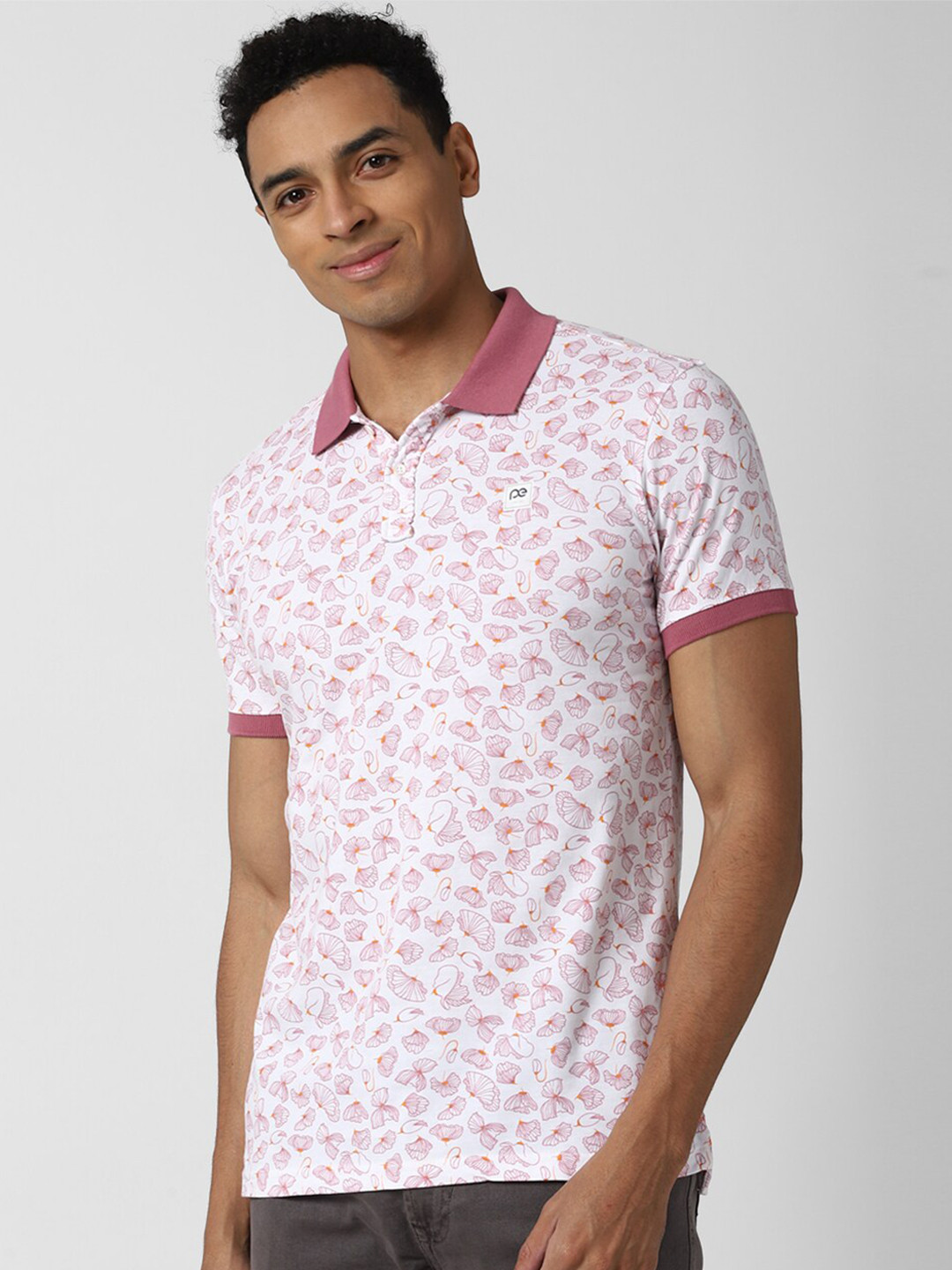 

Peter England Casuals Men White & Pink Floral Polo Collar Tropical Slim Fit Cotton T-shirt