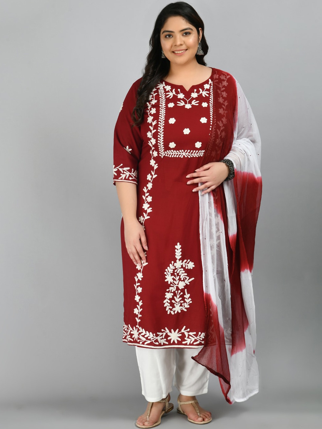 

PrettyPlus by Desinoor.com Maroon Floral Embroidered Kurta with Trousers & Dupatta